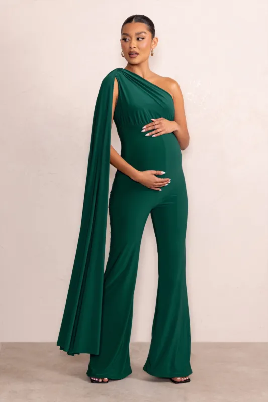 Sing To Sleep | Bottle Green Maternity One Shoulder Cape Jumpsuit sold by Club L London