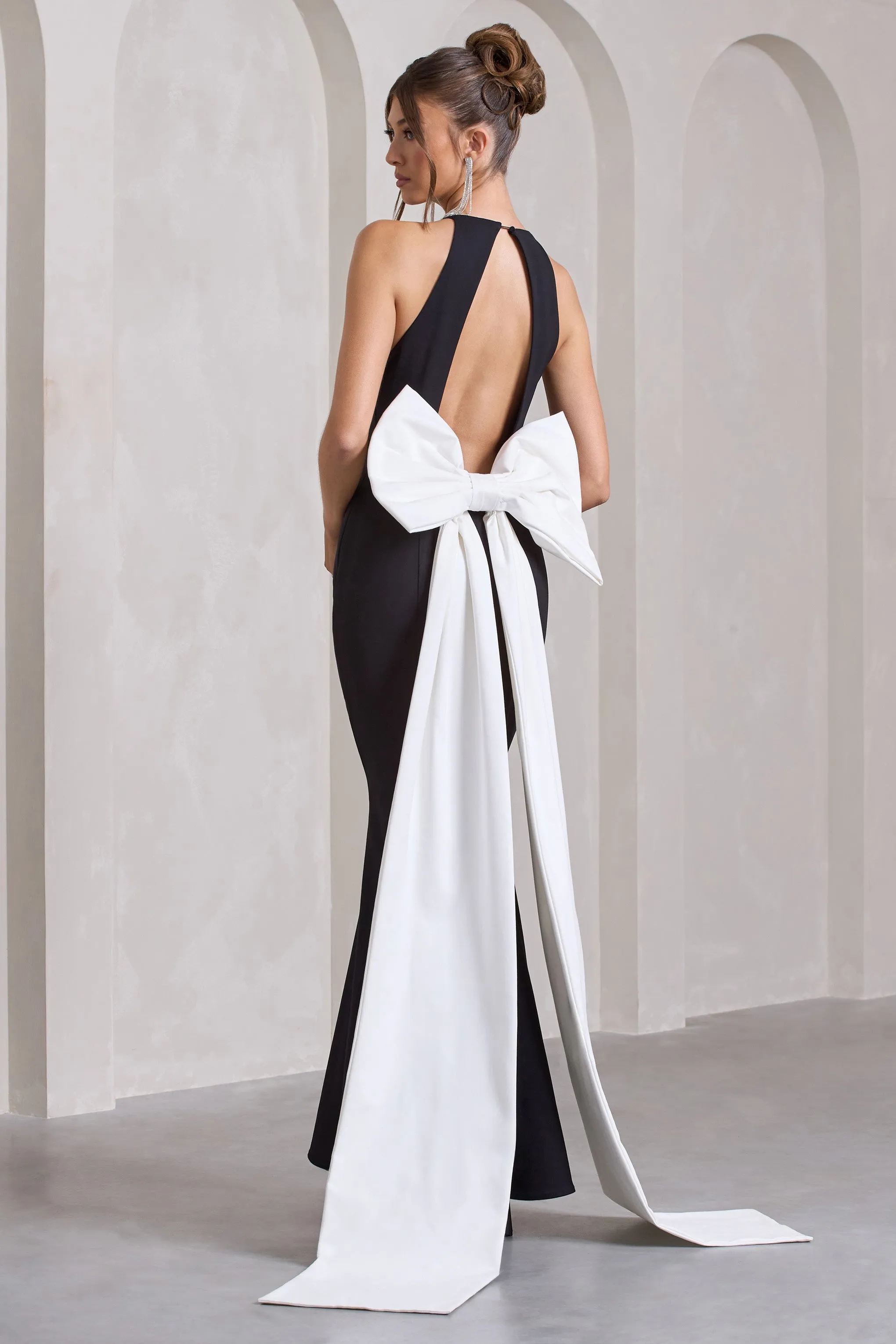 Bestow | Black Open-Back Maxi Dress With Oversized White Bow sold by Club L London