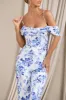 From The Vine | Blue Floral Strappy Drape-Sleeved Corset Jumpsuit sold by Club L London