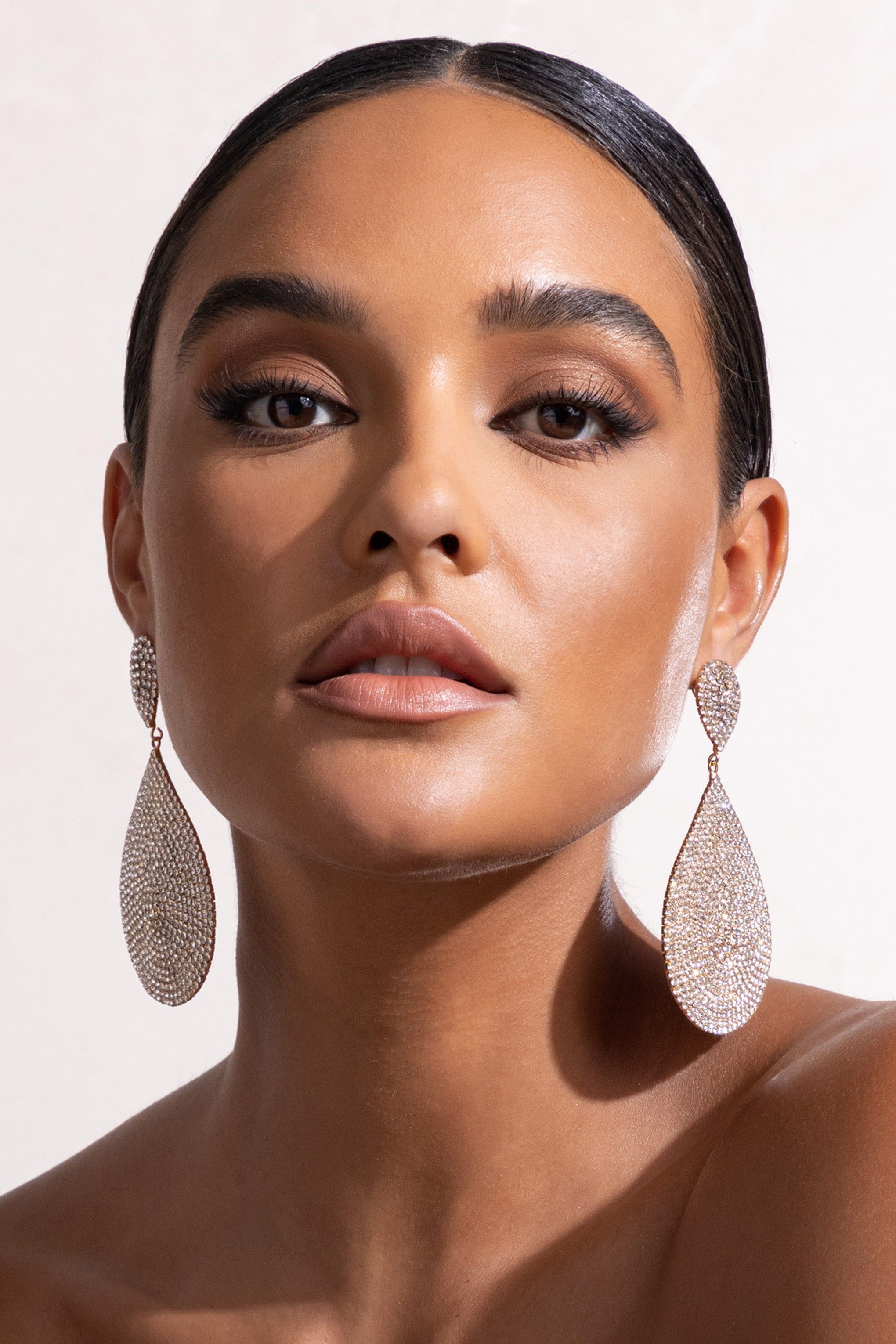 Lucia | Gold Diamante Statement Teardrop Earrings sold by Club L London