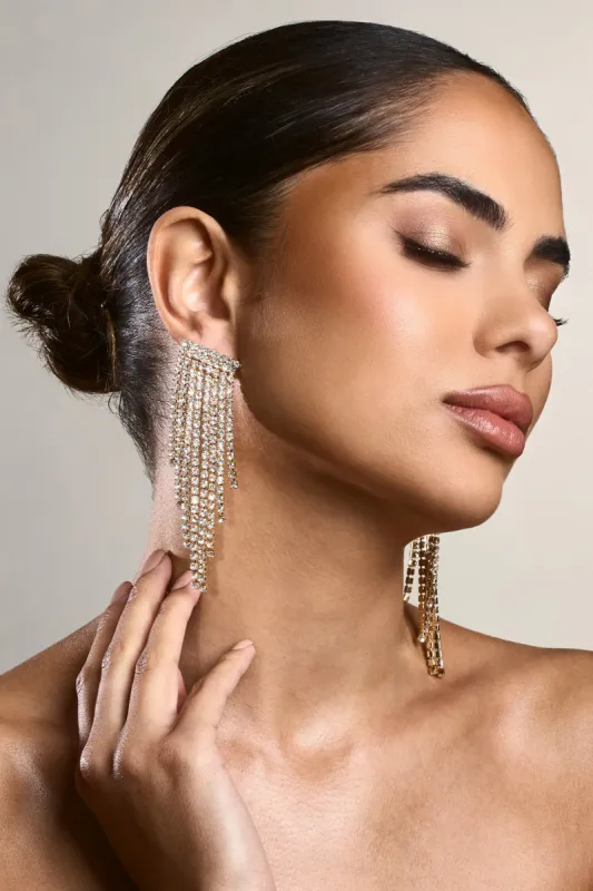 Twinkle | Gold Diamante Tassel Earrings sold by Club L London