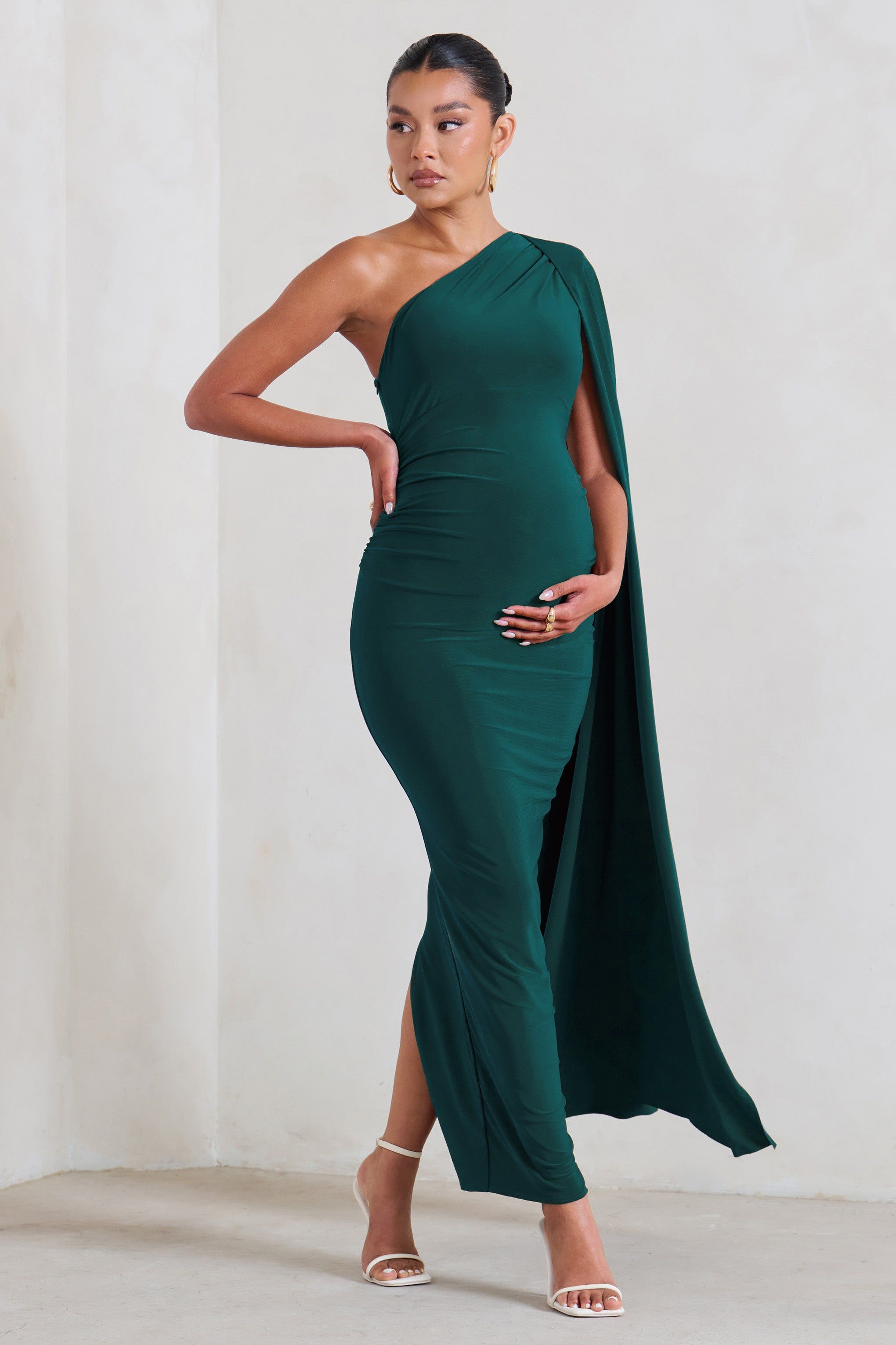 Amaryllis | Bottle Green Maternity One Shoulder Maxi Dress with Cape Sleeve sold by Club L London