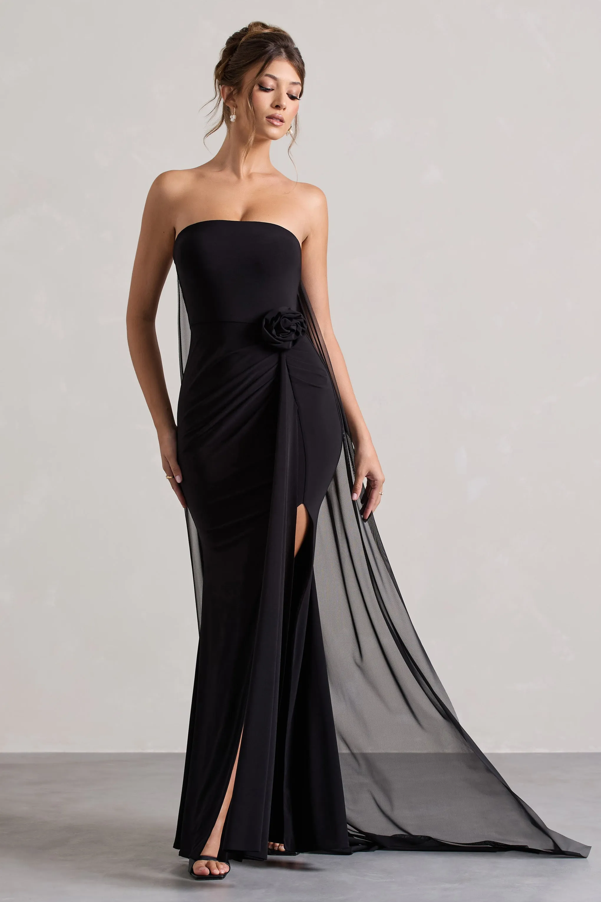 More To Come | Black Strapless Wrap Cape Maxi Dress With Corsage sold by Club L London