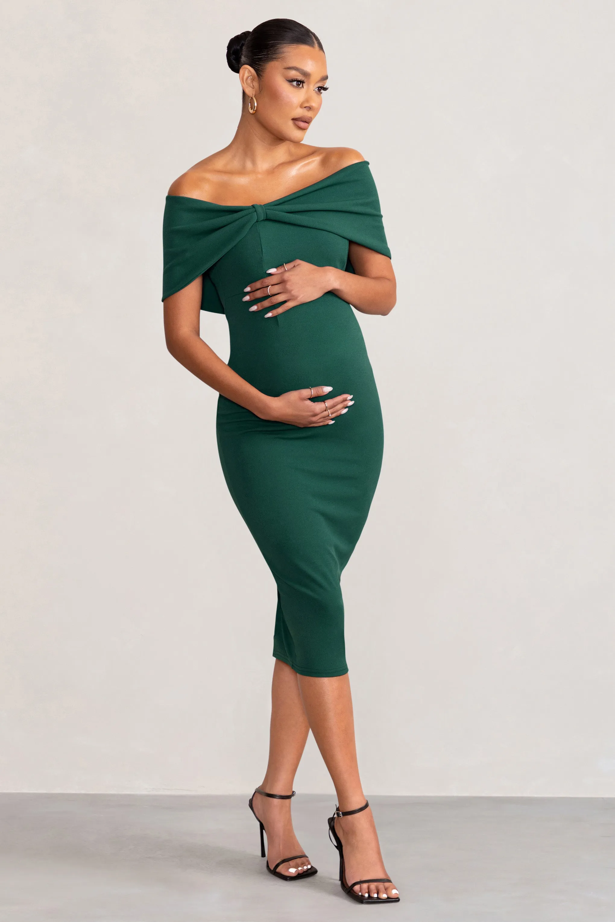 Alyssa | Bottle Green Bardot Bow Maternity Midi Dress with Ruching sold by Club L London