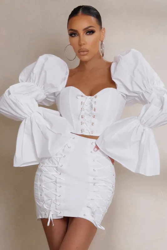 Blushing | White Tiered Puff Sleeve Corset Top sold by Club L London