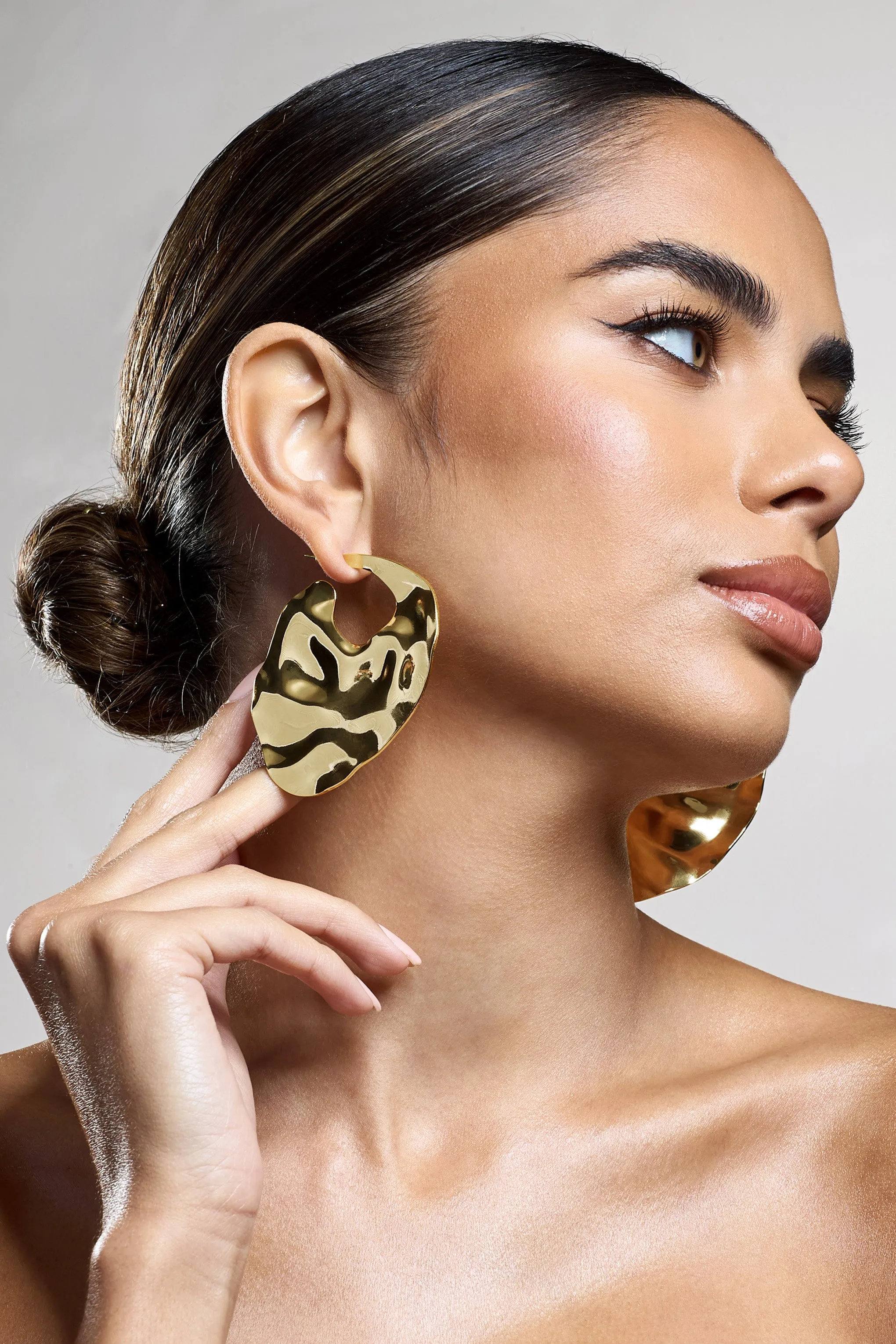 Journey | Gold Textured Abstract Disc Earrings sold by Club L London