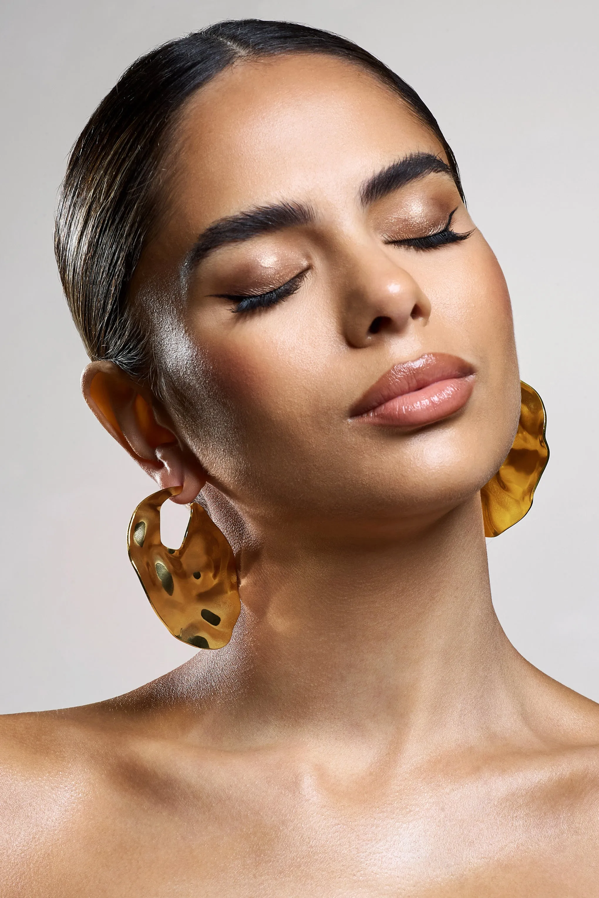 Journey | Gold Textured Abstract Disc Earrings sold by Club L London product image thumbnail 4