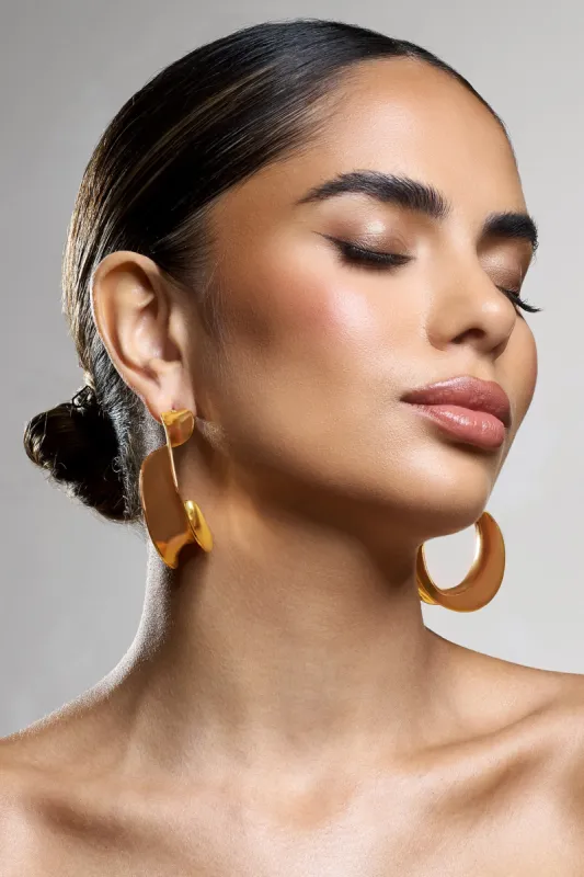 Athalia | Gold Twist Abstract Earrings sold by Club L London