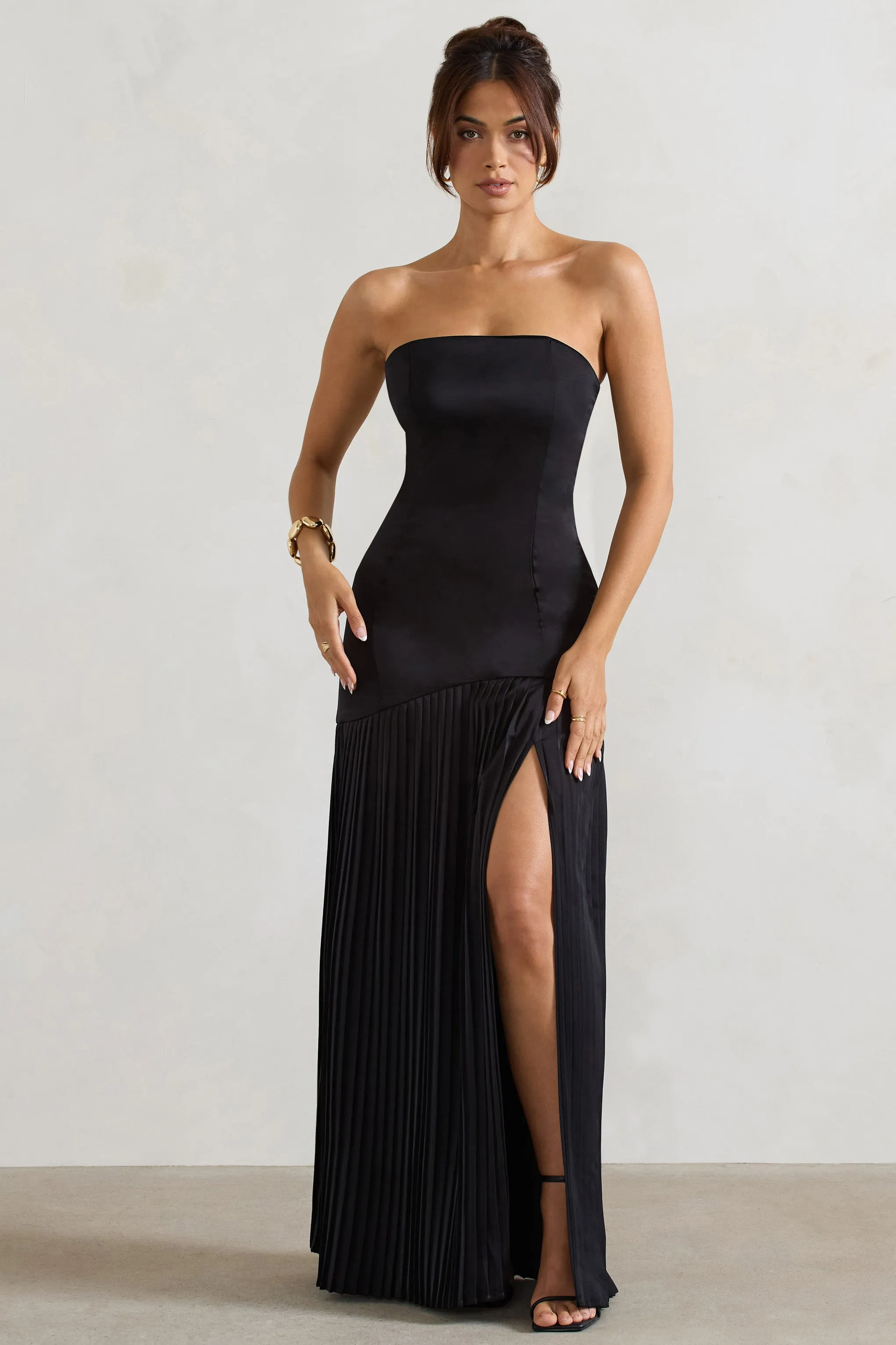 Confidence | Black Satin Bandeau Pleated Split Maxi Dress sold by Club L London