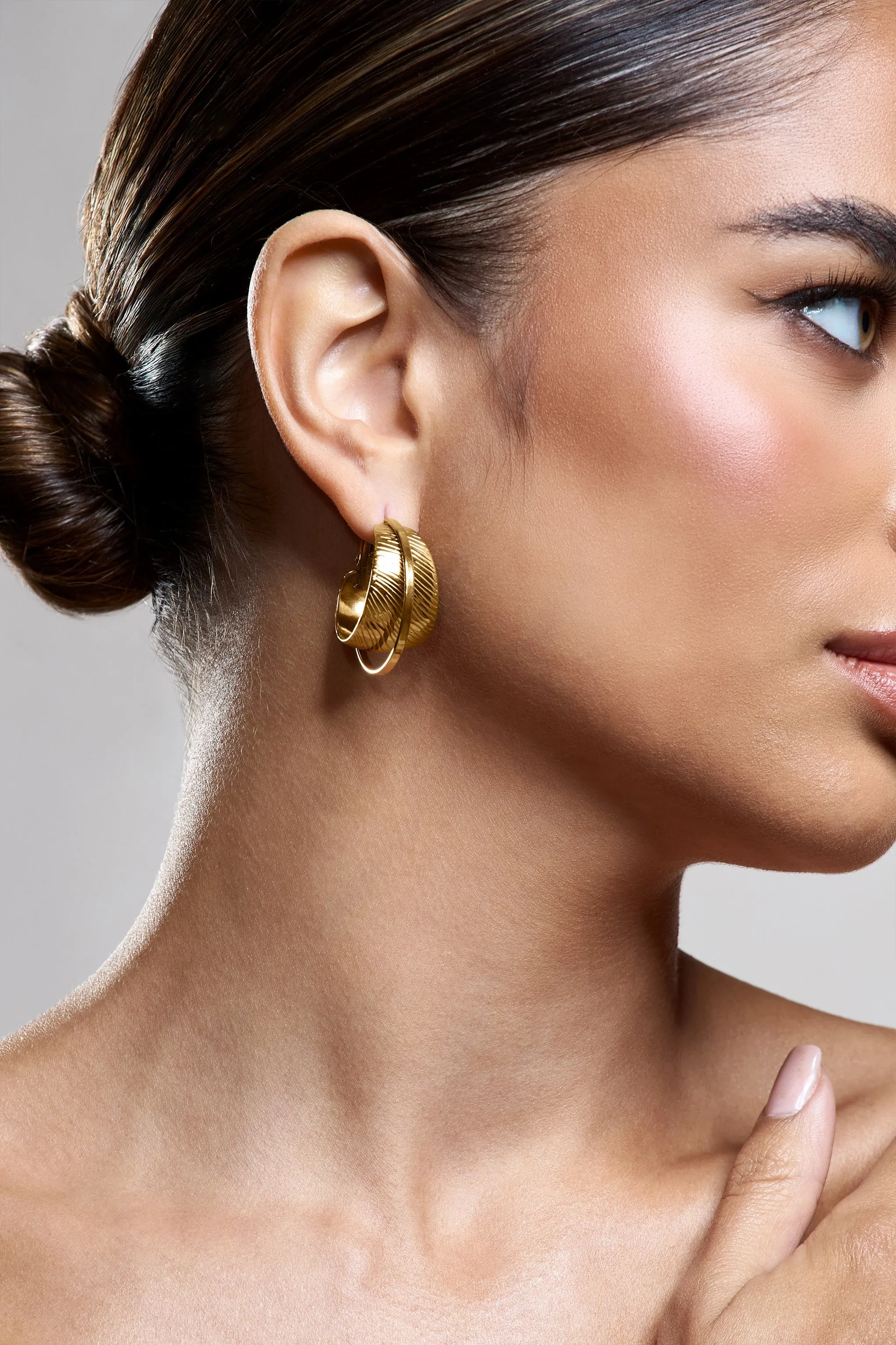 Liko | Gold Layered Hoop Earrings sold by Club L London product image thumbnail 3