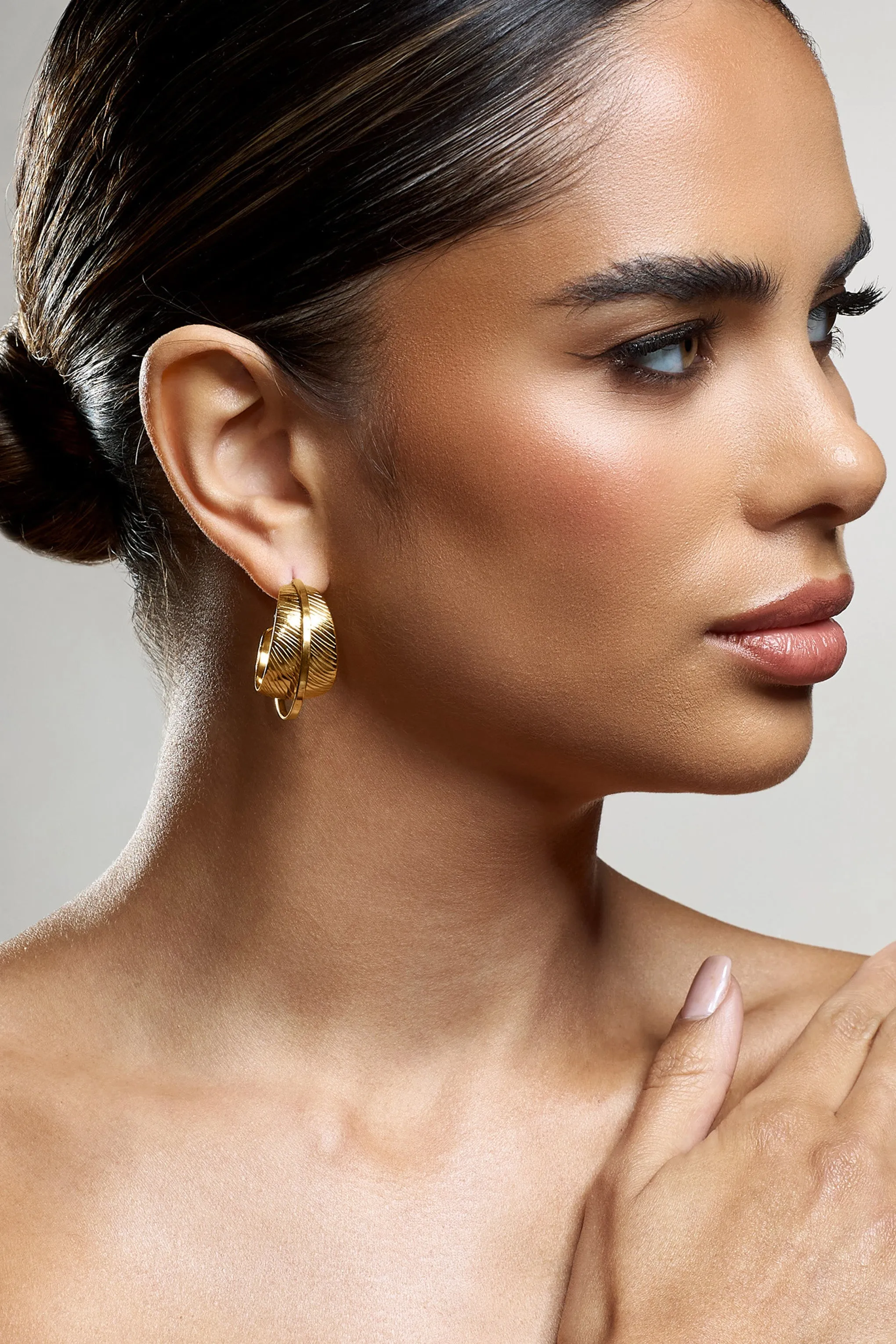 Liko | Gold Layered Hoop Earrings sold by Club L London product image thumbnail 4