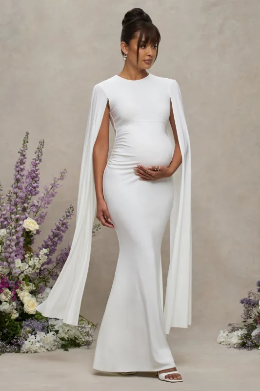 Divine Timing | White Maternity Maxi Dress With Cape Sleeves sold by Club L London