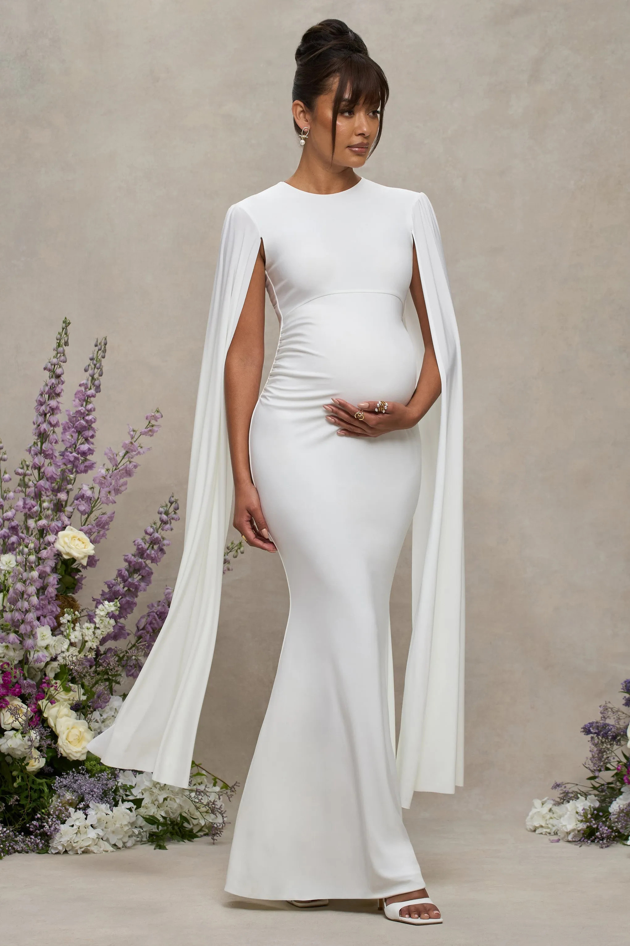 Divine Timing | White Maternity Maxi Dress With Cape Sleeves sold by Club L London