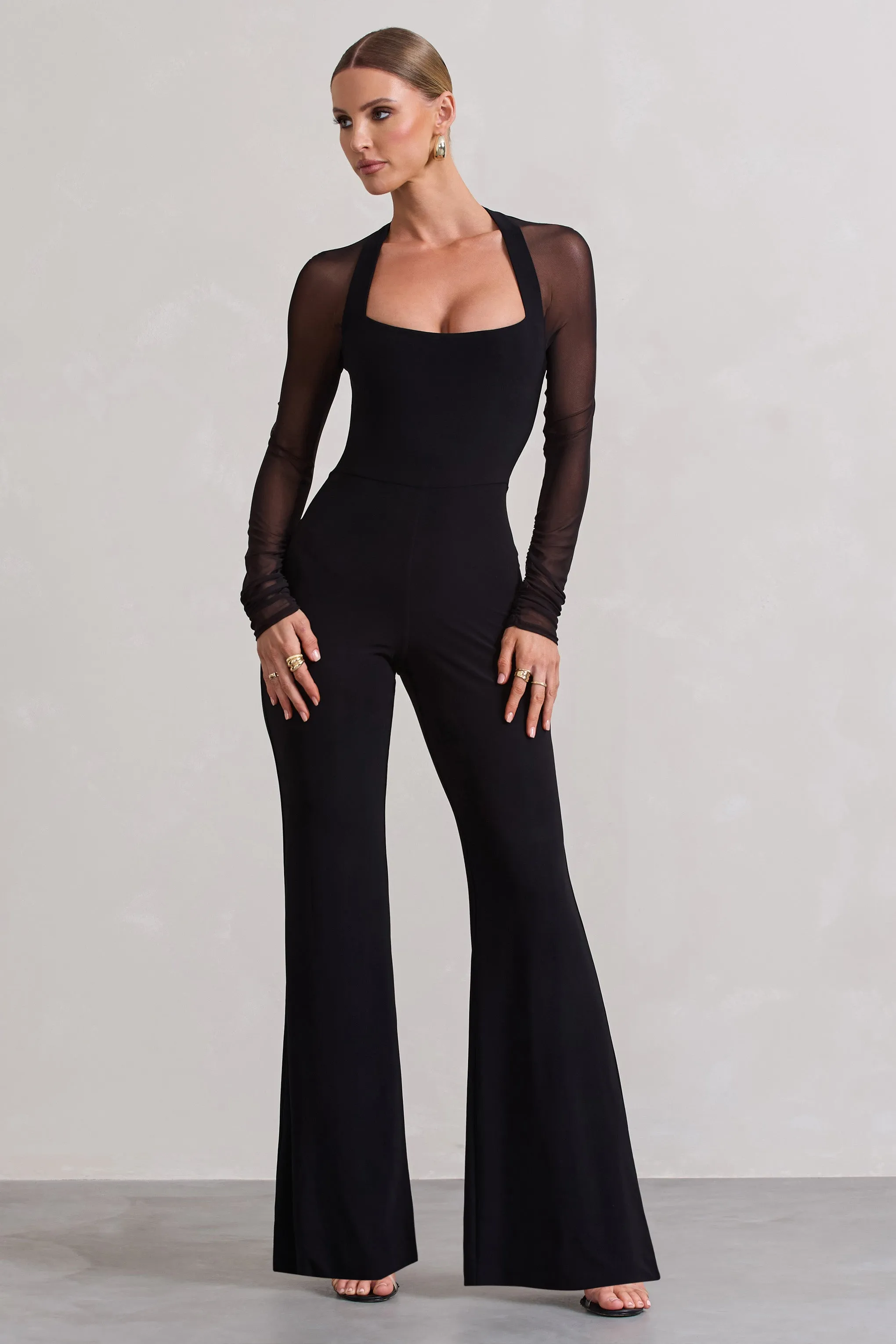 On Track | Black Flared-Leg Jumpsuit With Sheer Sleeves sold by Club L London
