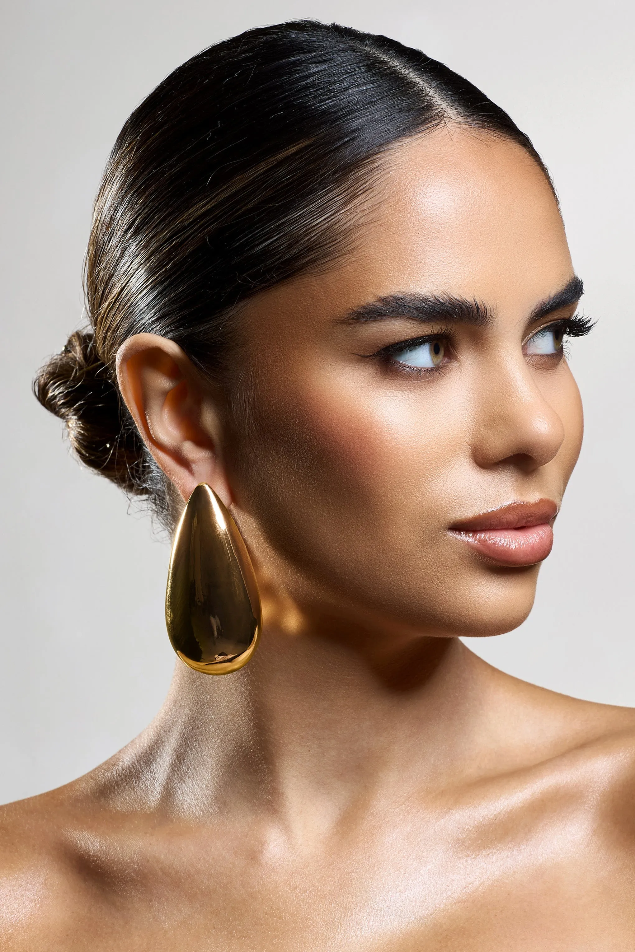 Amiya | Gold Statement Teardrop Earrings sold by Club L London