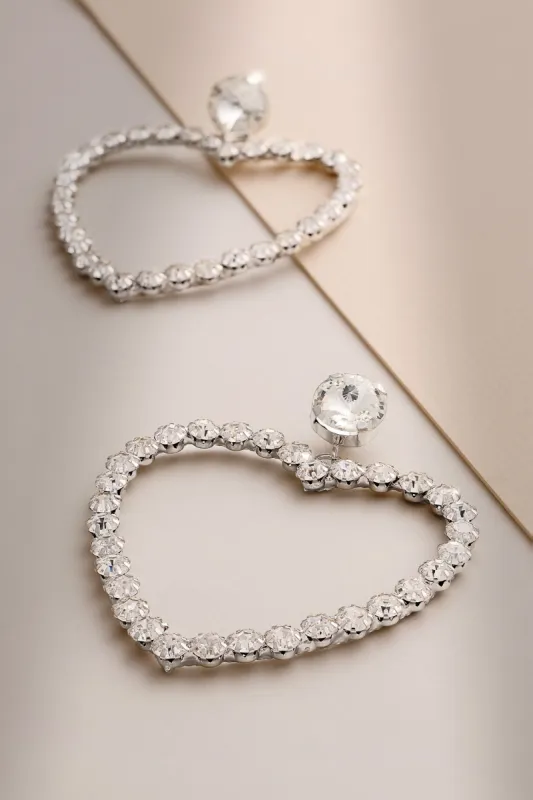 Lia | Silver Diamante Heart Hoop Drop Earrings sold by Club L London