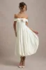 Calliopia | Cream Bow Bardot Midi Dress With Puff-Ball Skirt sold by Club L London