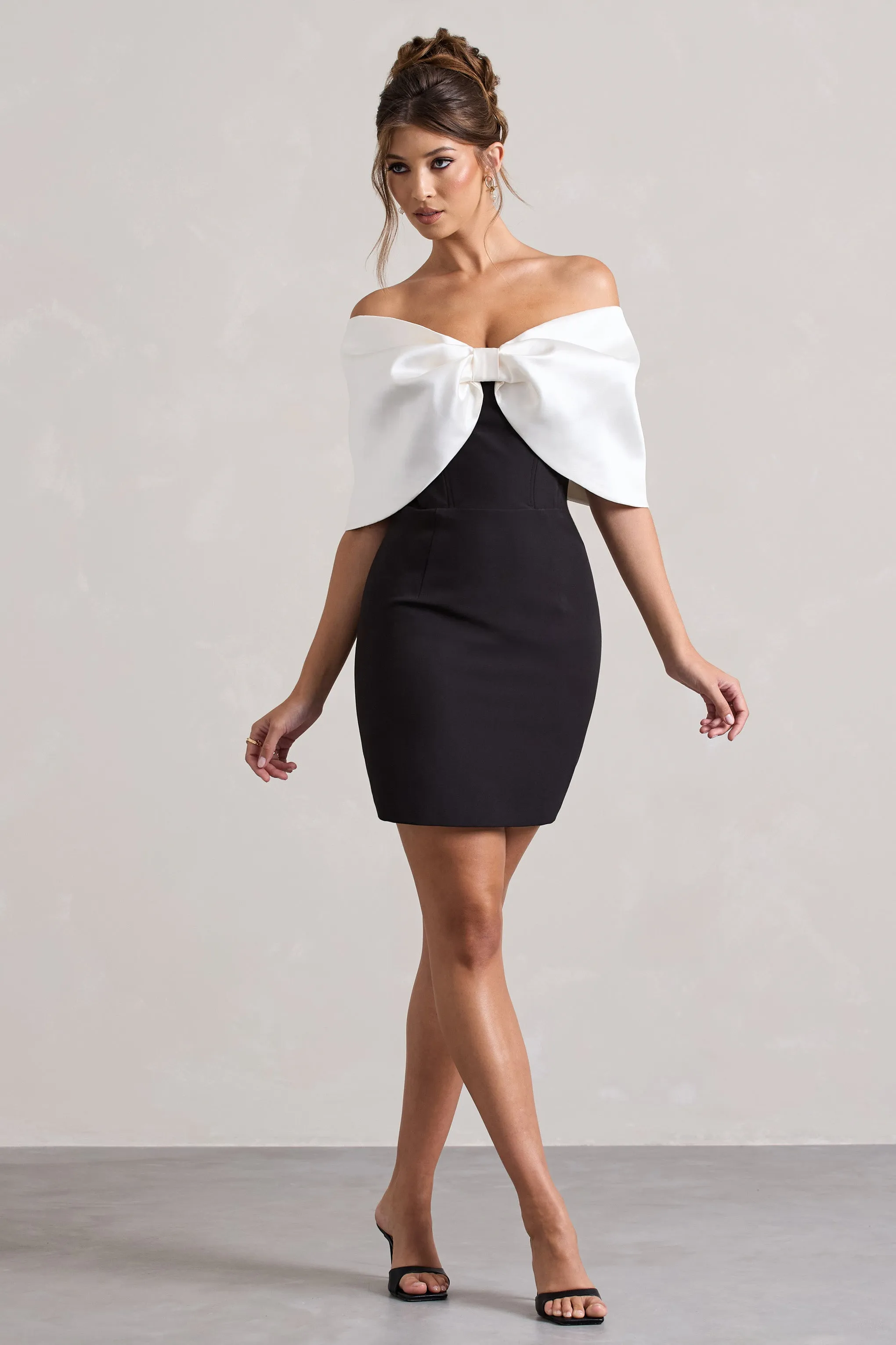 Dewdrop | Black & White Mini Dress With Oversized Bow sold by Club L London