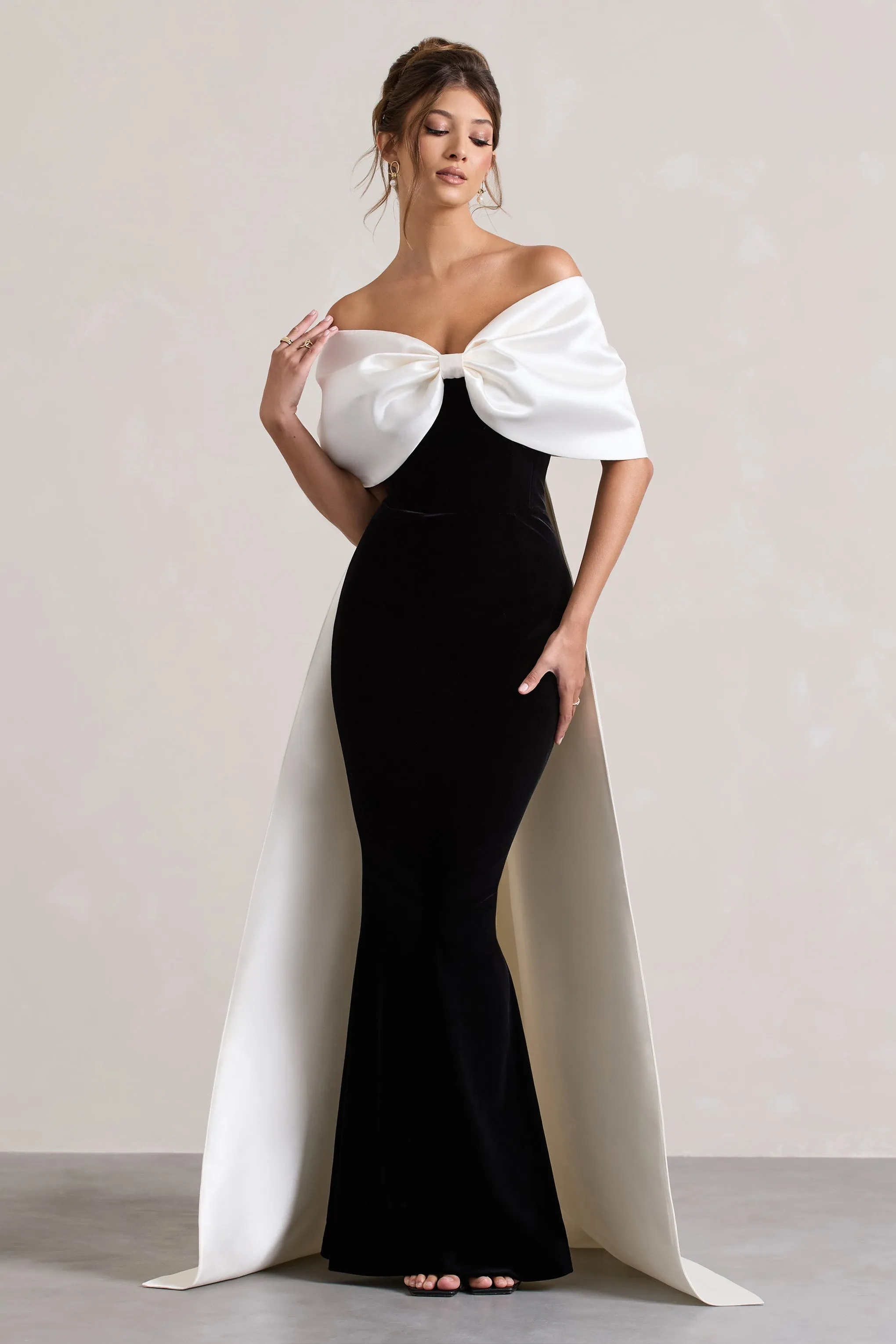 Wanting More | Black & White Satin Cape Maxi Dress With Oversized Bow sold by Club L London
