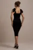 Tarna | Black Velvet Midi Dress With Bow Straps sold by Club L London