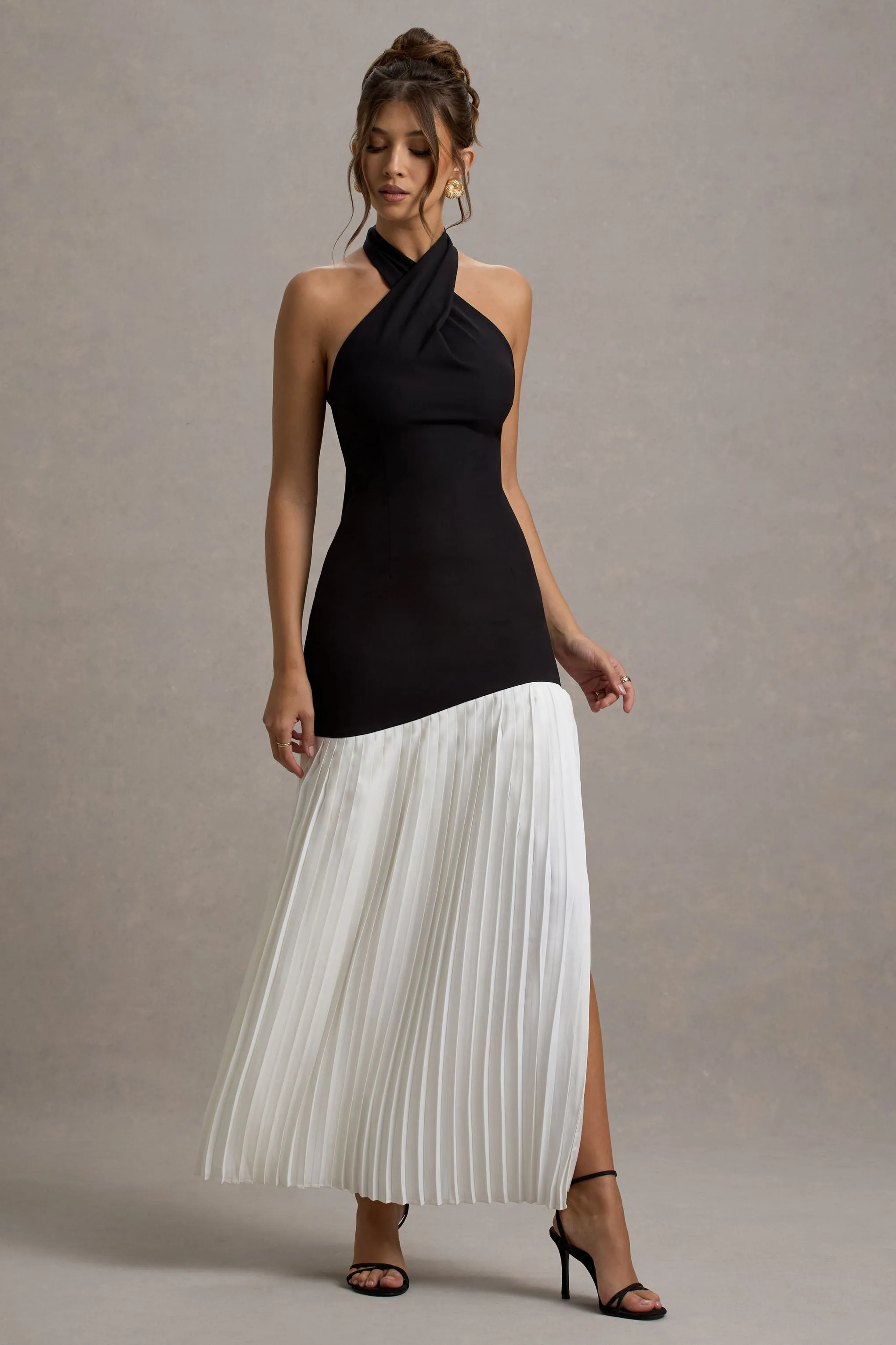 Khai | Black & White Halter-Neck Maxi Dress With Plisse Skirt sold by Club L London