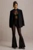 Romelle | Black Mesh Flared-Leg Trousers sold by Club L London