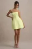 Anniston | Lemon Bandeau Tailored Button Mini Dress sold by Club L London