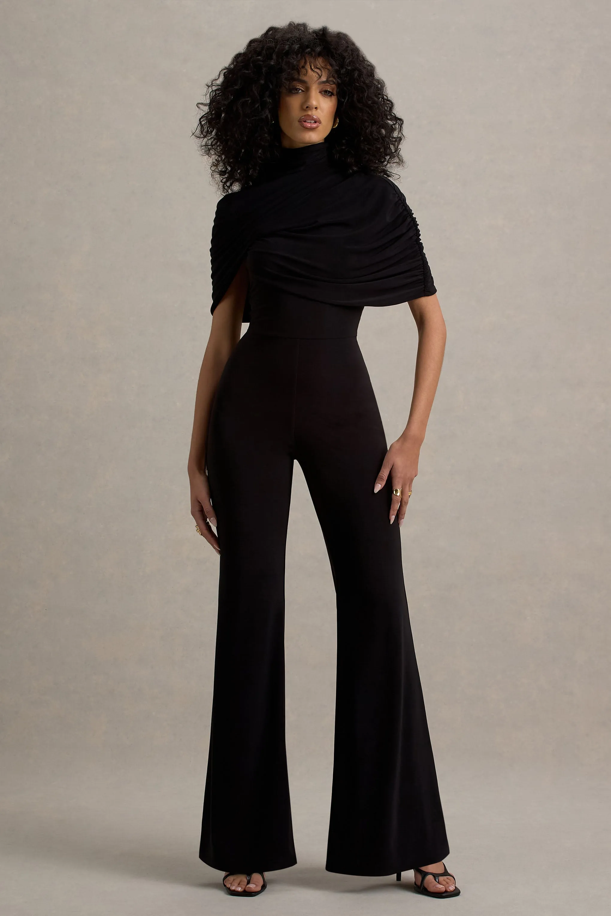 Isoline | Black Twist Cape Flared-Leg Jumpsuit sold by Club L London