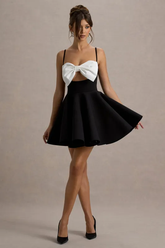 Yasmina | Black & White Bow Skater Mini Dress sold by Club L London