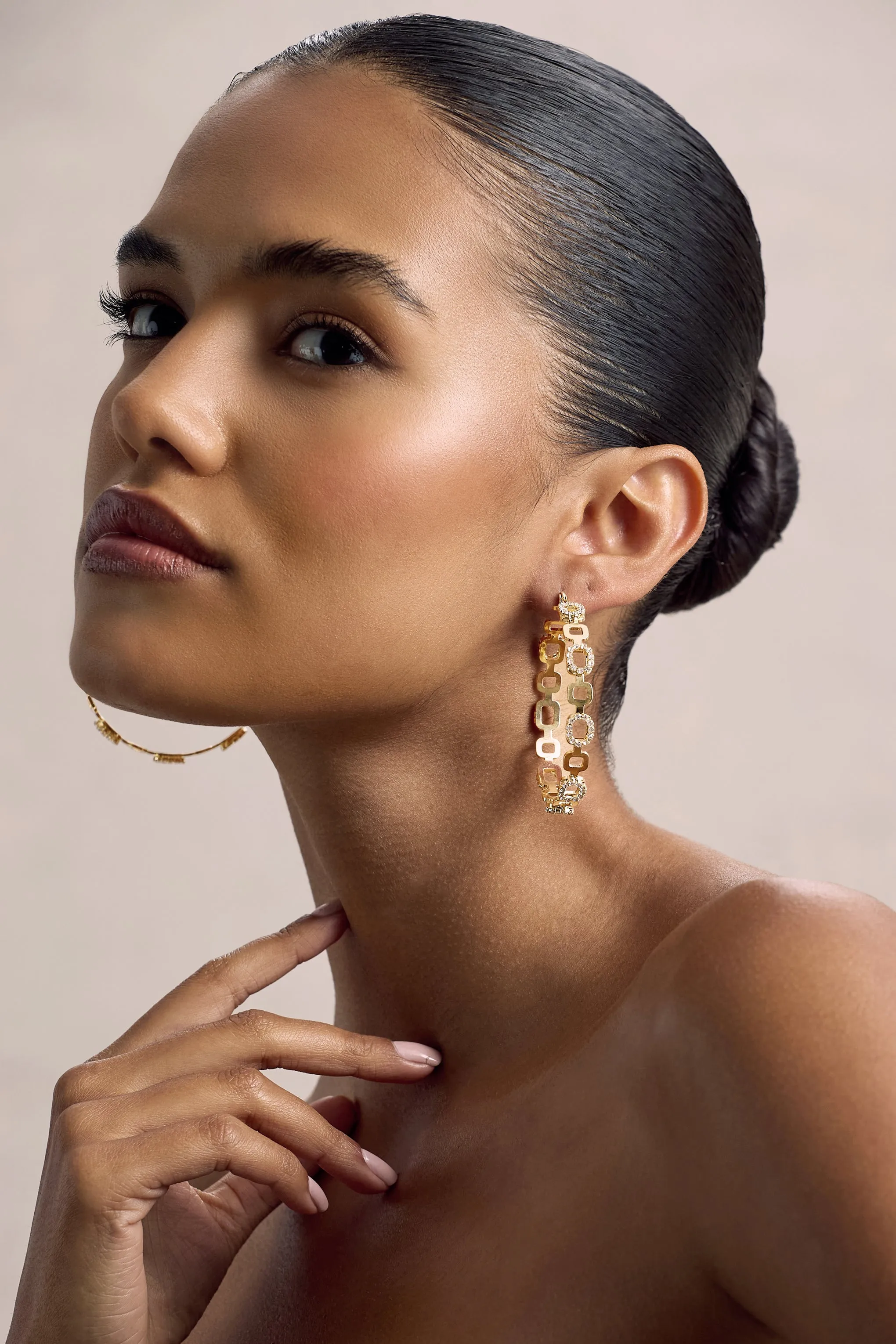 Interlinked | Gold Diamante Chain Hoop Earrings sold by Club L London