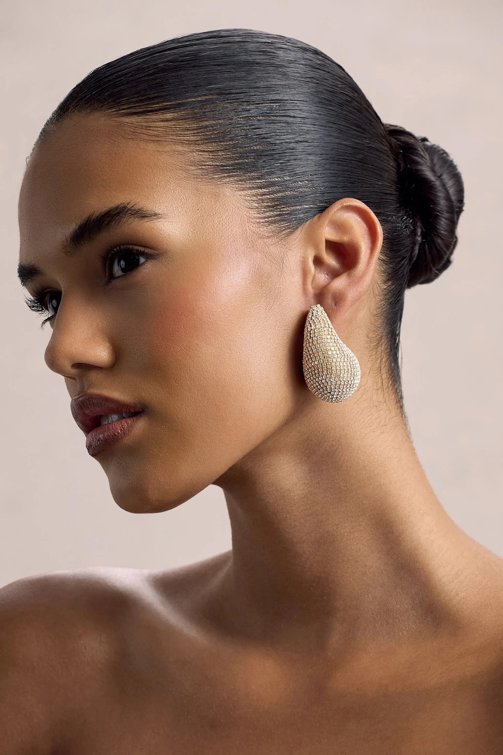 True Icon | Gold Diamante Statement Teardrop Earrings sold by Club L London