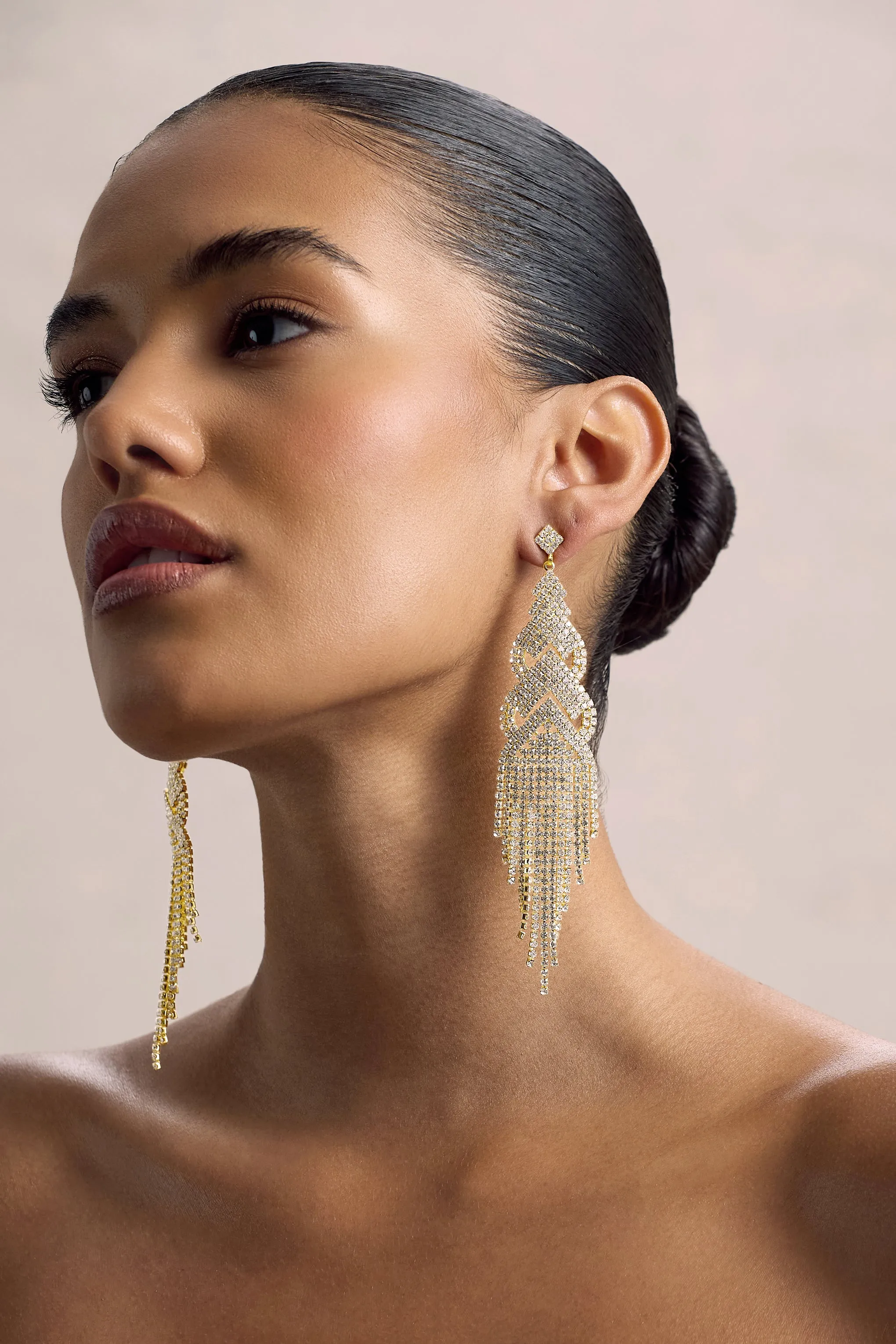 Adorn | Gold Diamante Statement Tassel Drop Earrings sold by Club L London