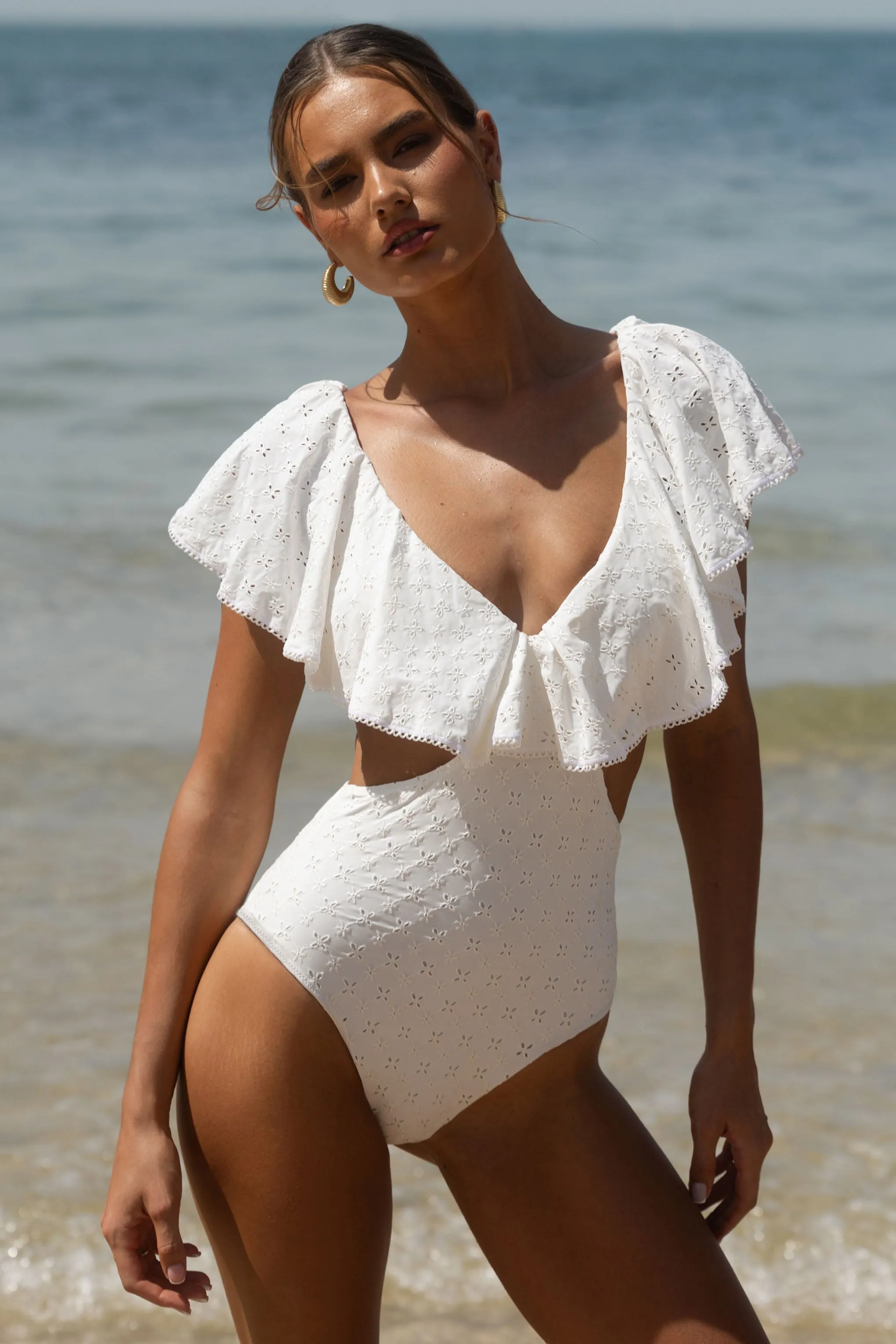 Soft Sands | White Broderie Cut-Out Swimsuit With Ruffle Sleeves sold by Club L London