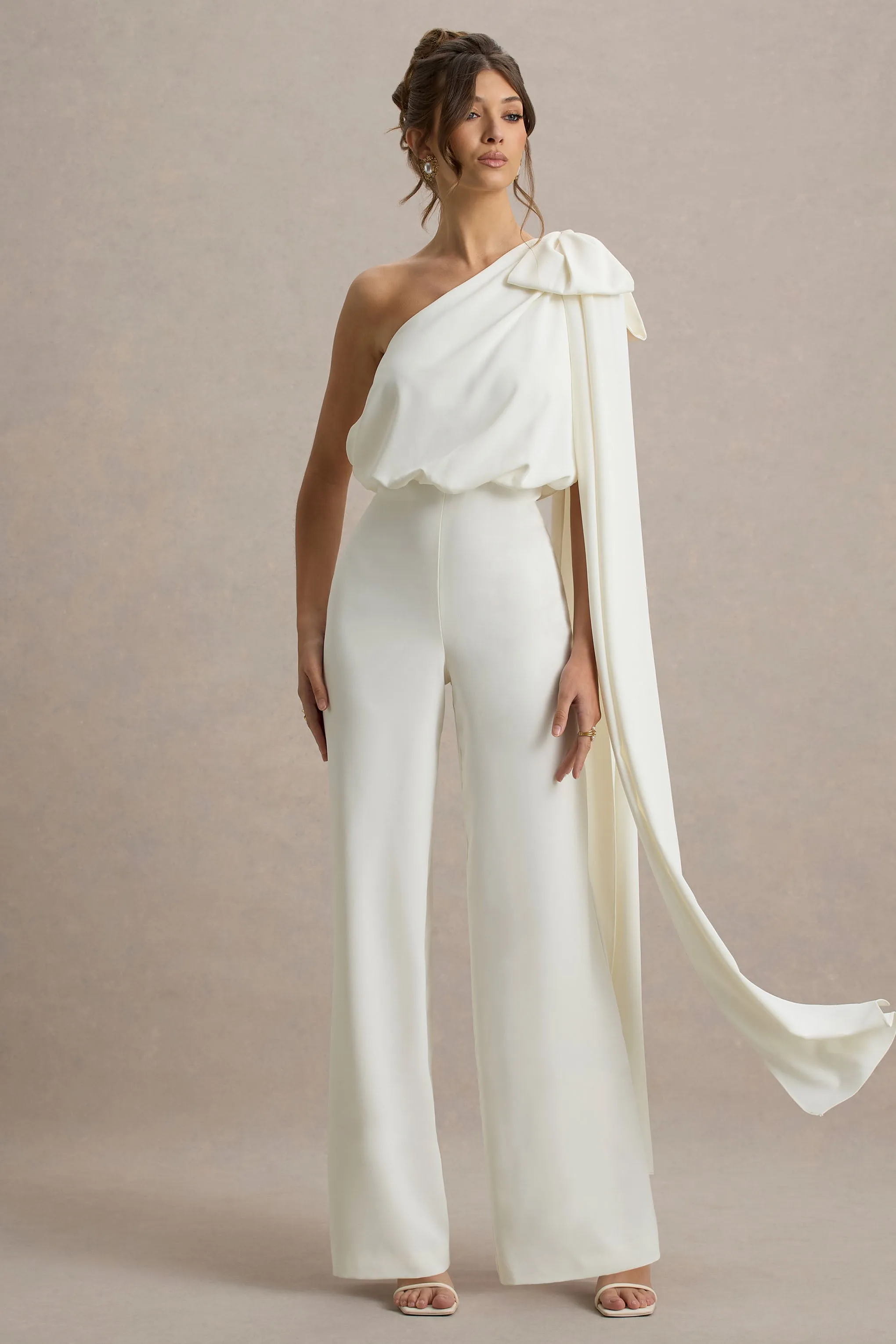 Alice | Cream Asymmetric Bow Shoulder Jumpsuit With Drape sold by Club L London