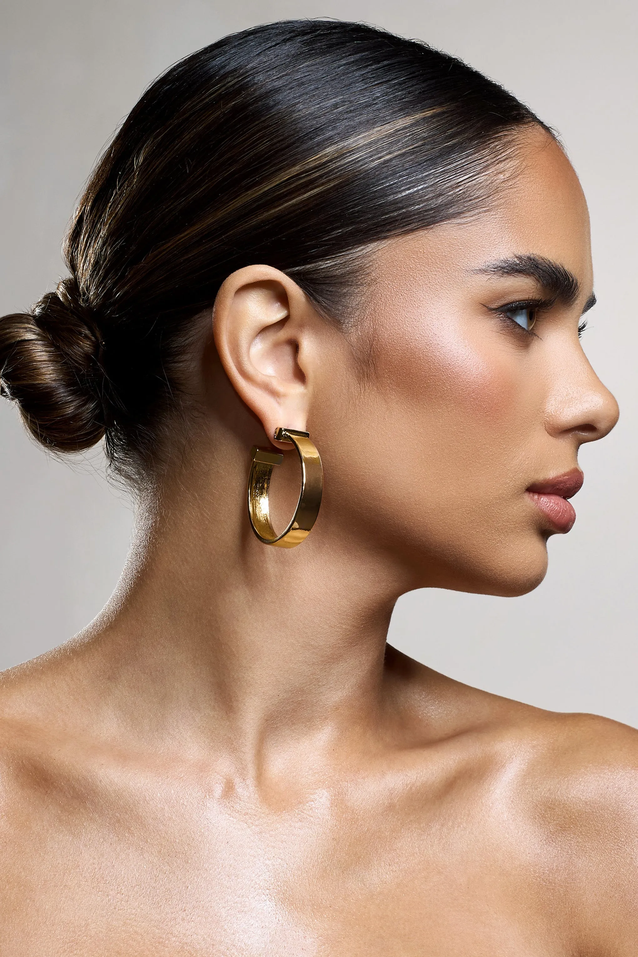 Amery | Gold Chunky Hoop Earrings sold by Club L London