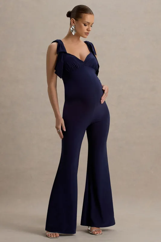 Impeccable | Navy Sweetheart Bow Strap Maternity Jumpsuit sold by Club L London