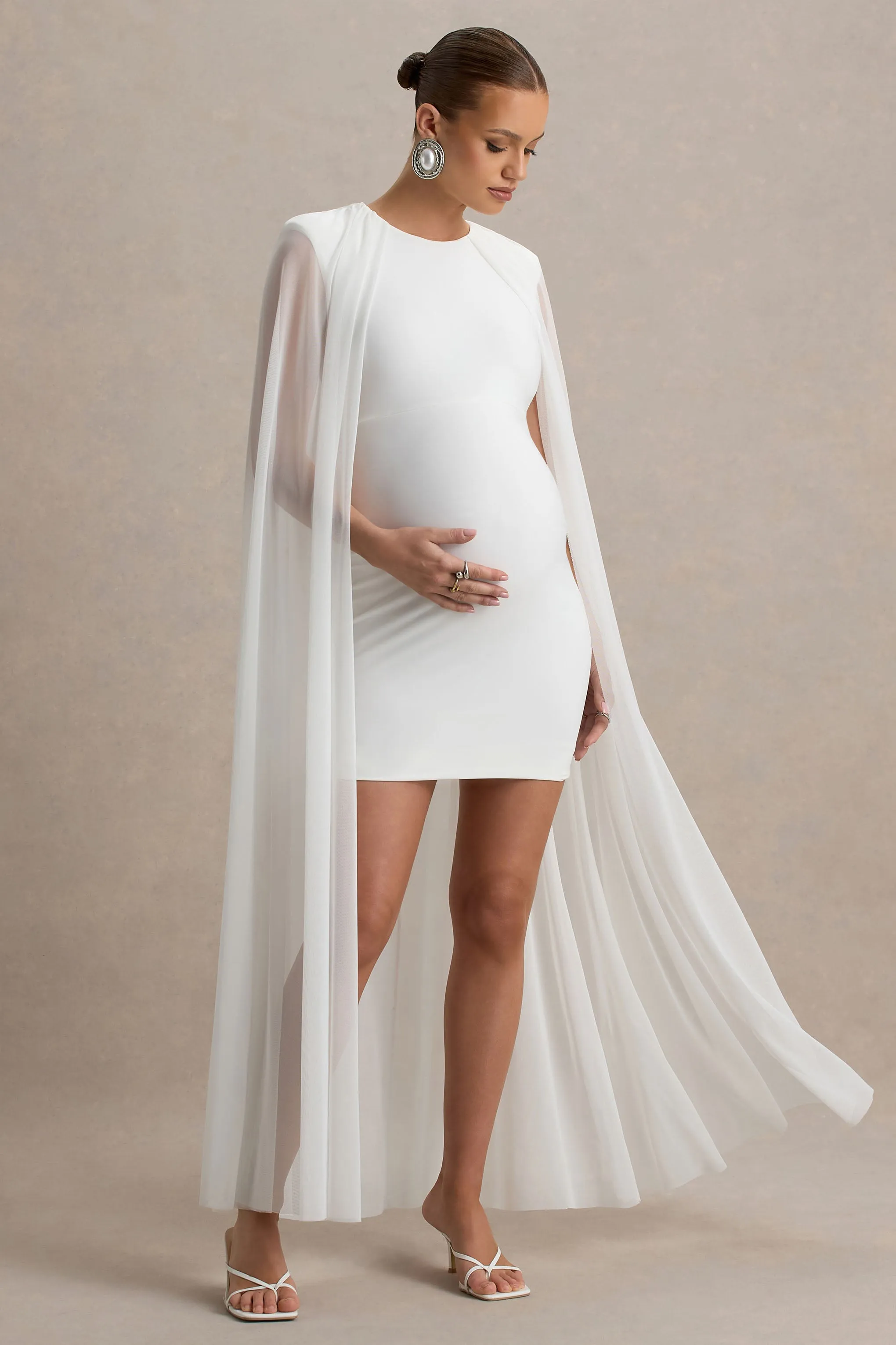Charlene | White High-Neck Maternity Mini Dress With Mesh Cape sold by Club L London