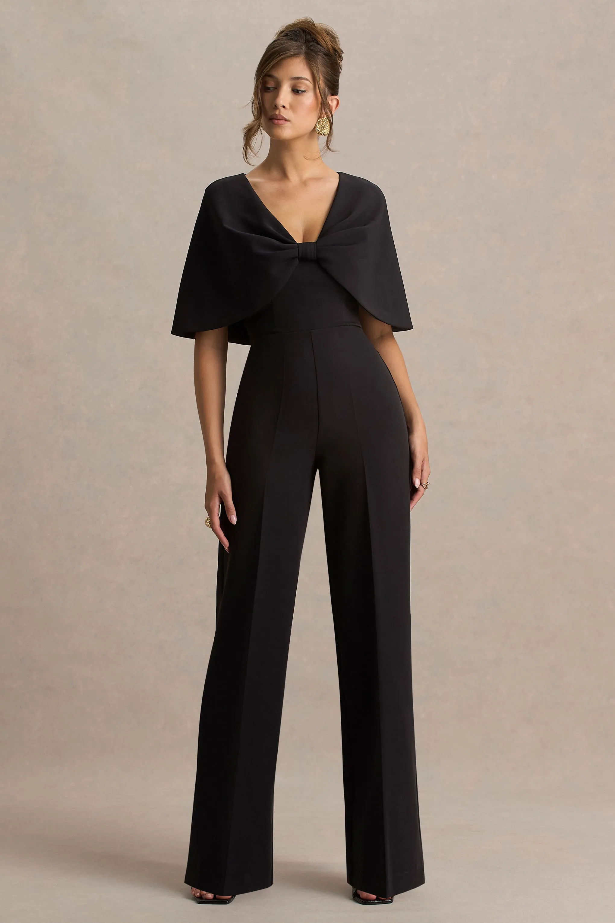 Vivid | Black Plunge-Neck Jumpsuit With Bow-Detail sold by Club L London