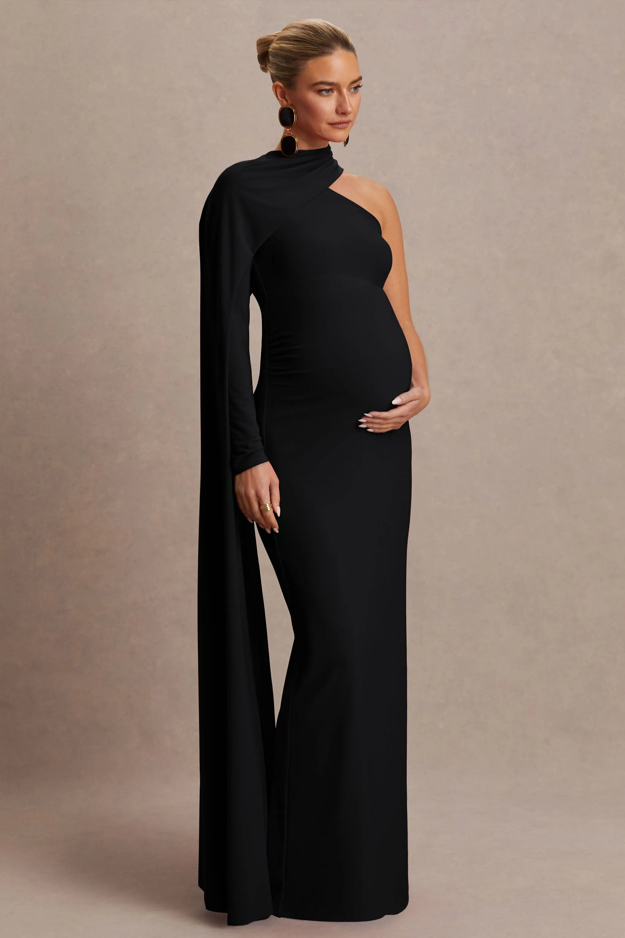 Tessy | Black Asymmetric-Neck Maternity Maxi Dress With Cape-Sleeve sold by Club L London