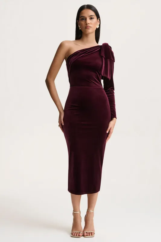 Vespera | Burgundy Velvet Asymmetric Neck Midi Dress With Bow Detail sold by Club L London