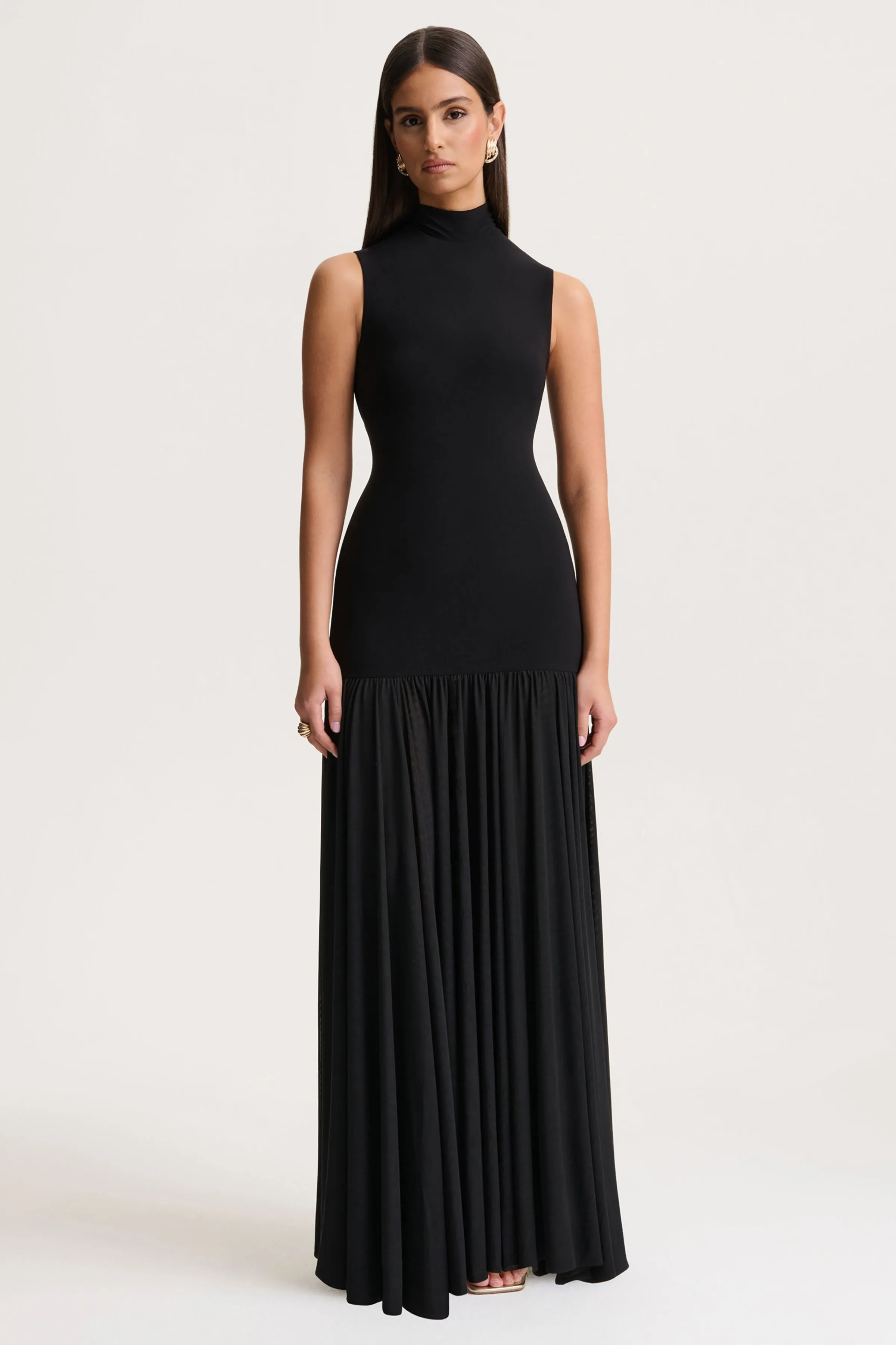 Gigi | Black High-Neck Maxi Dress With Drop-Waist And Sheer Skirt sold by Club L London