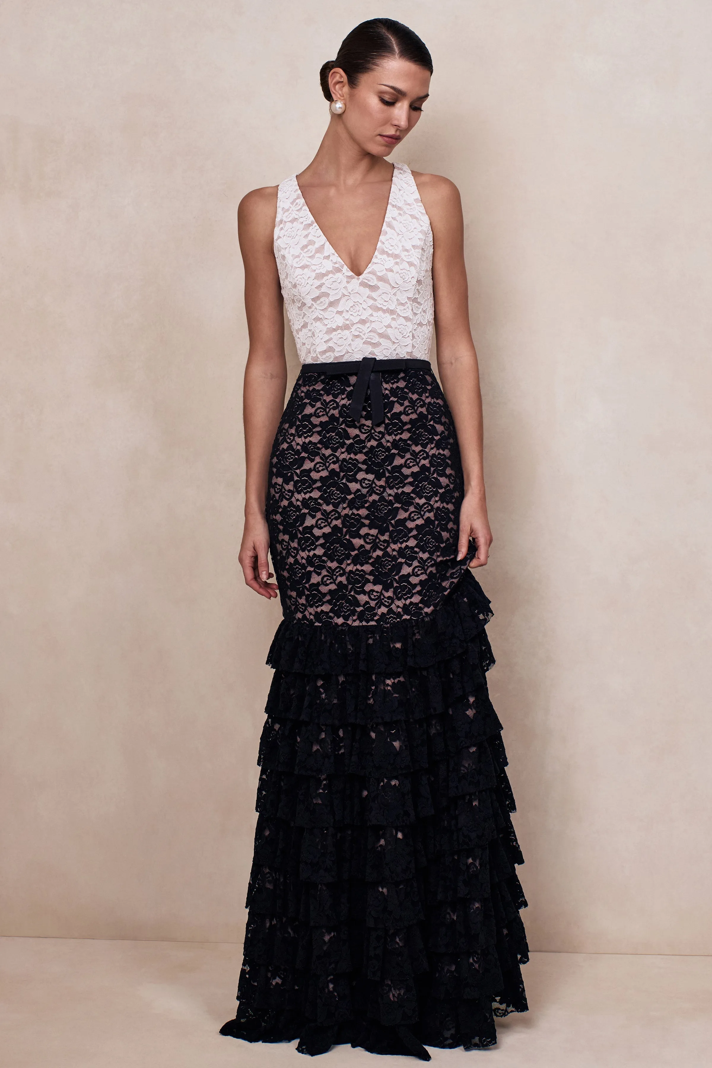 Isoria | Black And White Lace Halter-Neck Maxi Dress With Bow-Belt Detail sold by Club L London