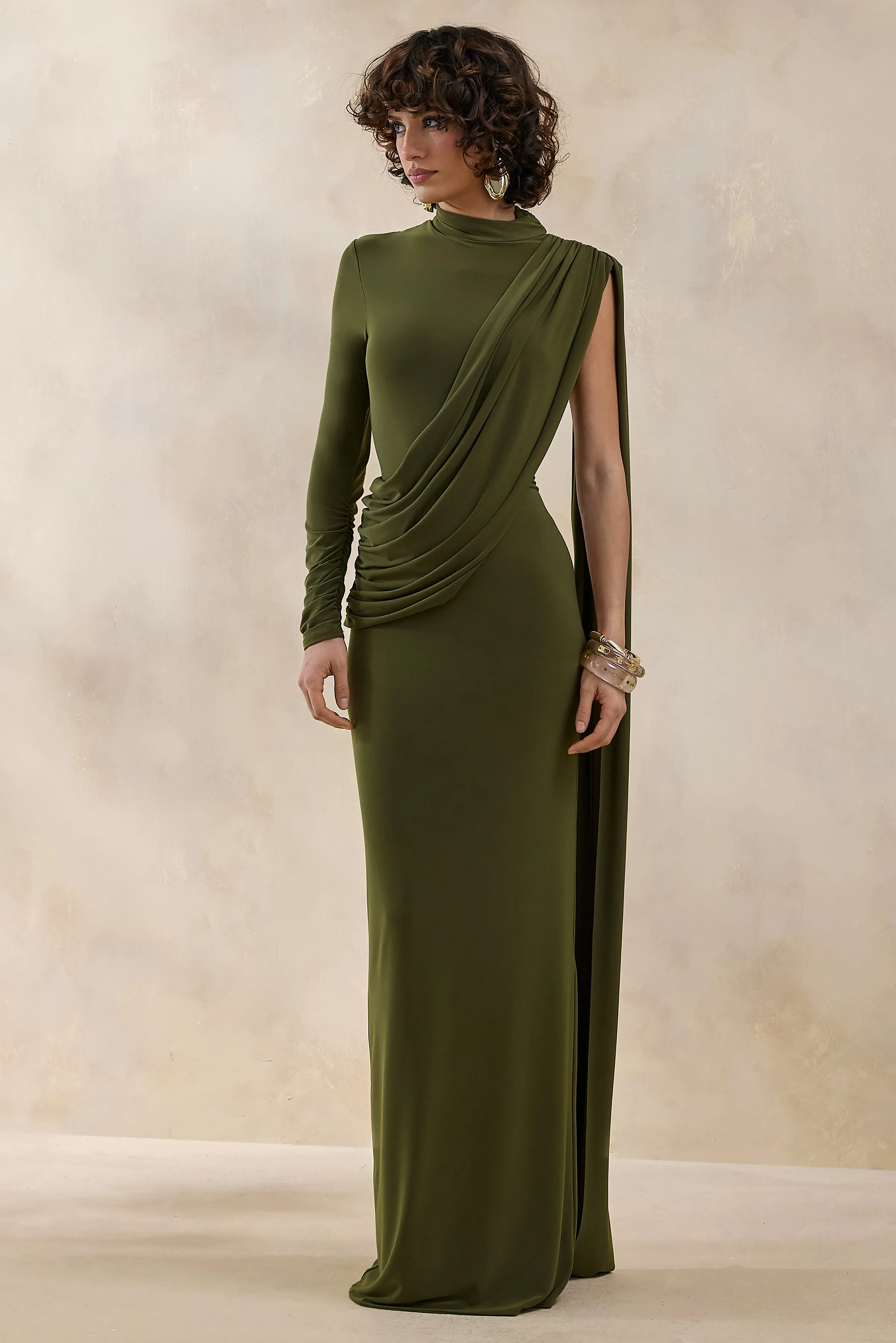 Oliria | Olive High-Neck Maxi Dress With One-Long Sleeve And Sash-Detail sold by Club L London