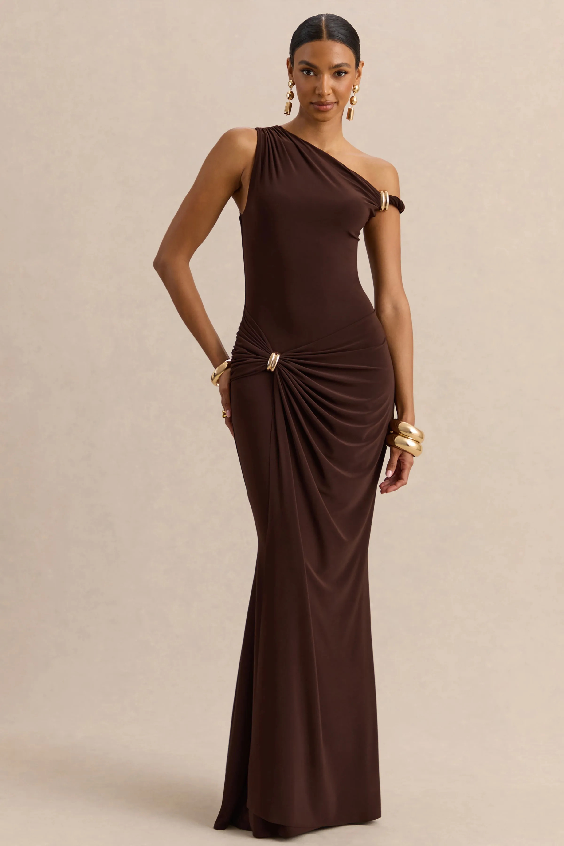 Caelia | Brown Asymmetric-Neck Maxi Dress With Gold-Detailing And Sash sold by Club L London