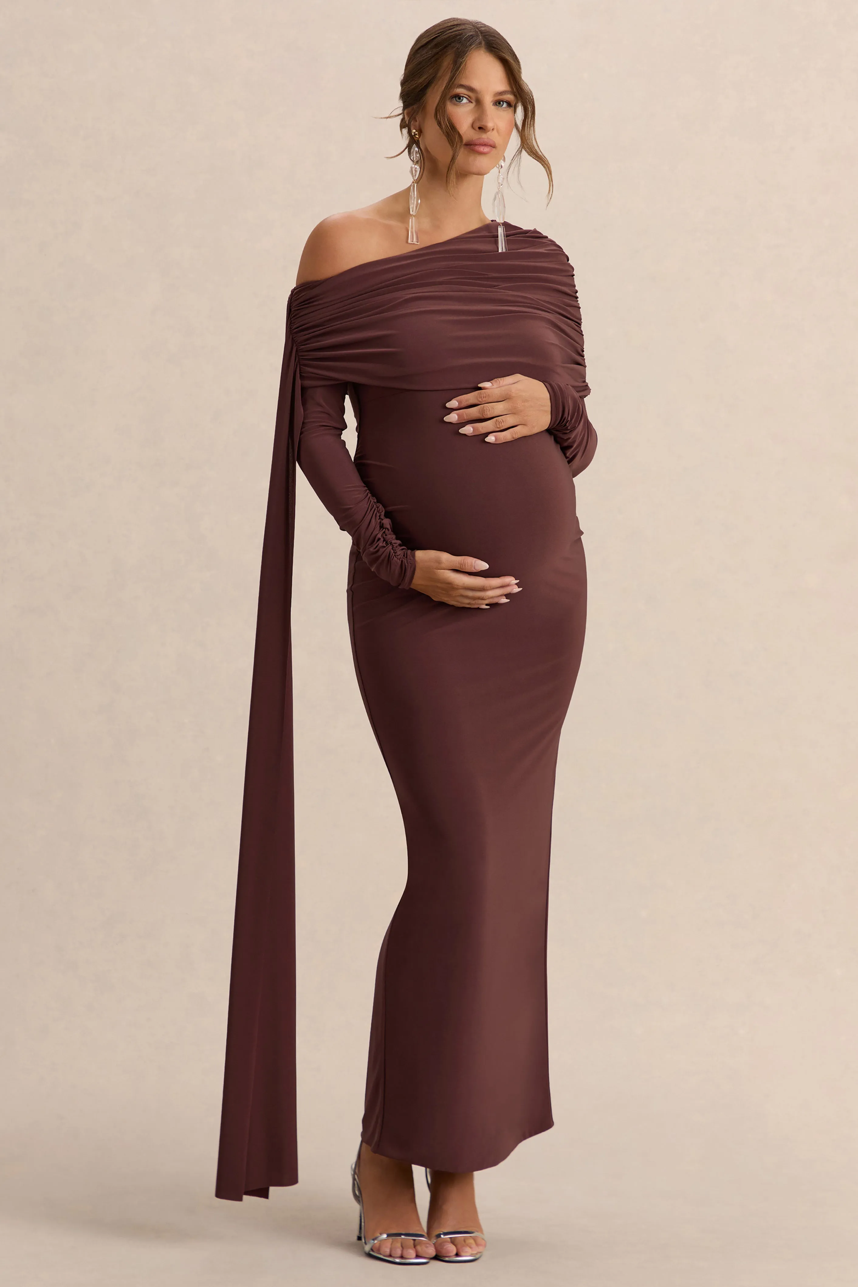 Cyra | Brown Asymmetric-Neck Maternity Maxi Dress With Sash sold by Club L London