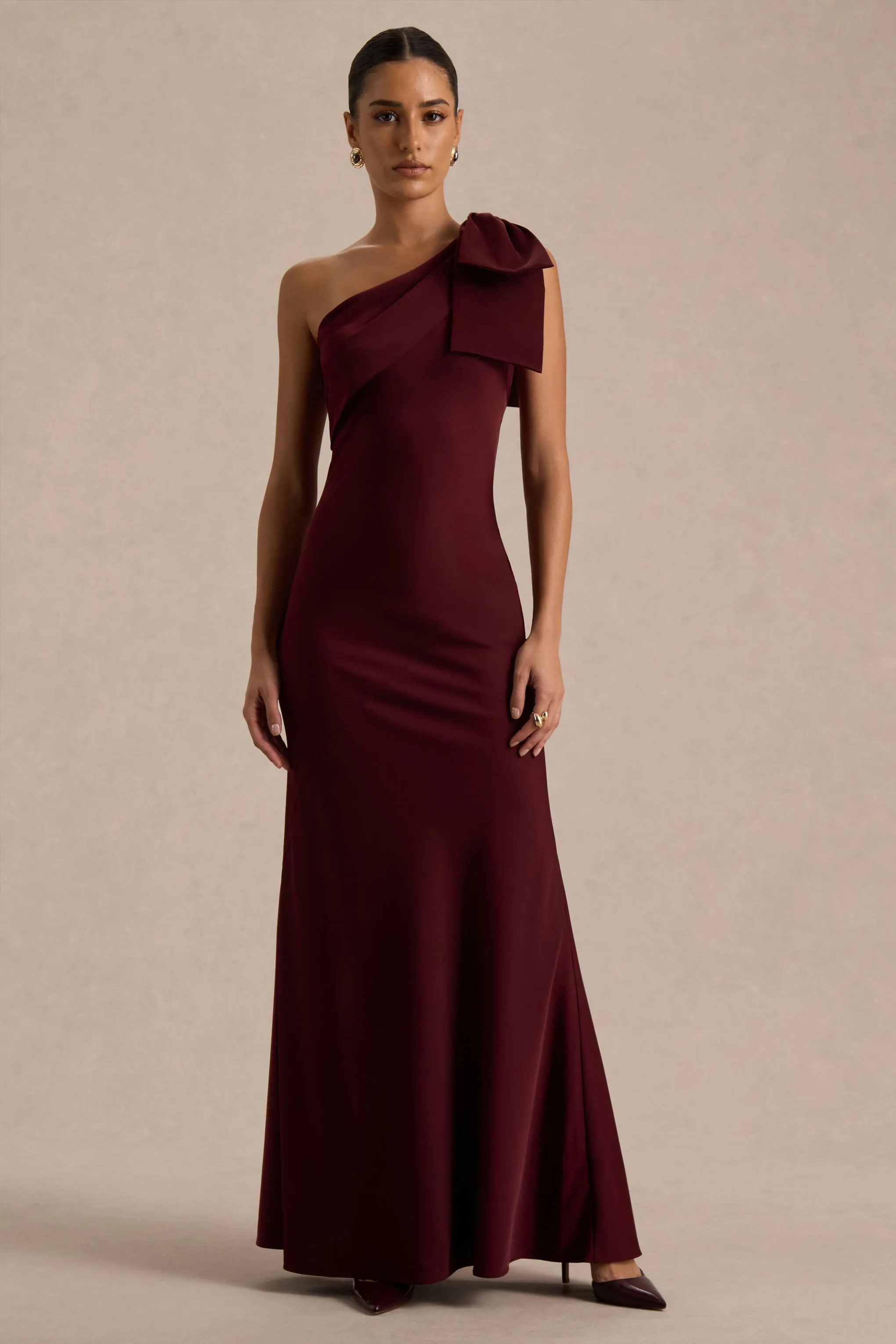 Josephine | Burgundy Matte Satin Asymmetric-Neck Maxi Dress With Bow Detail sold by Club L London