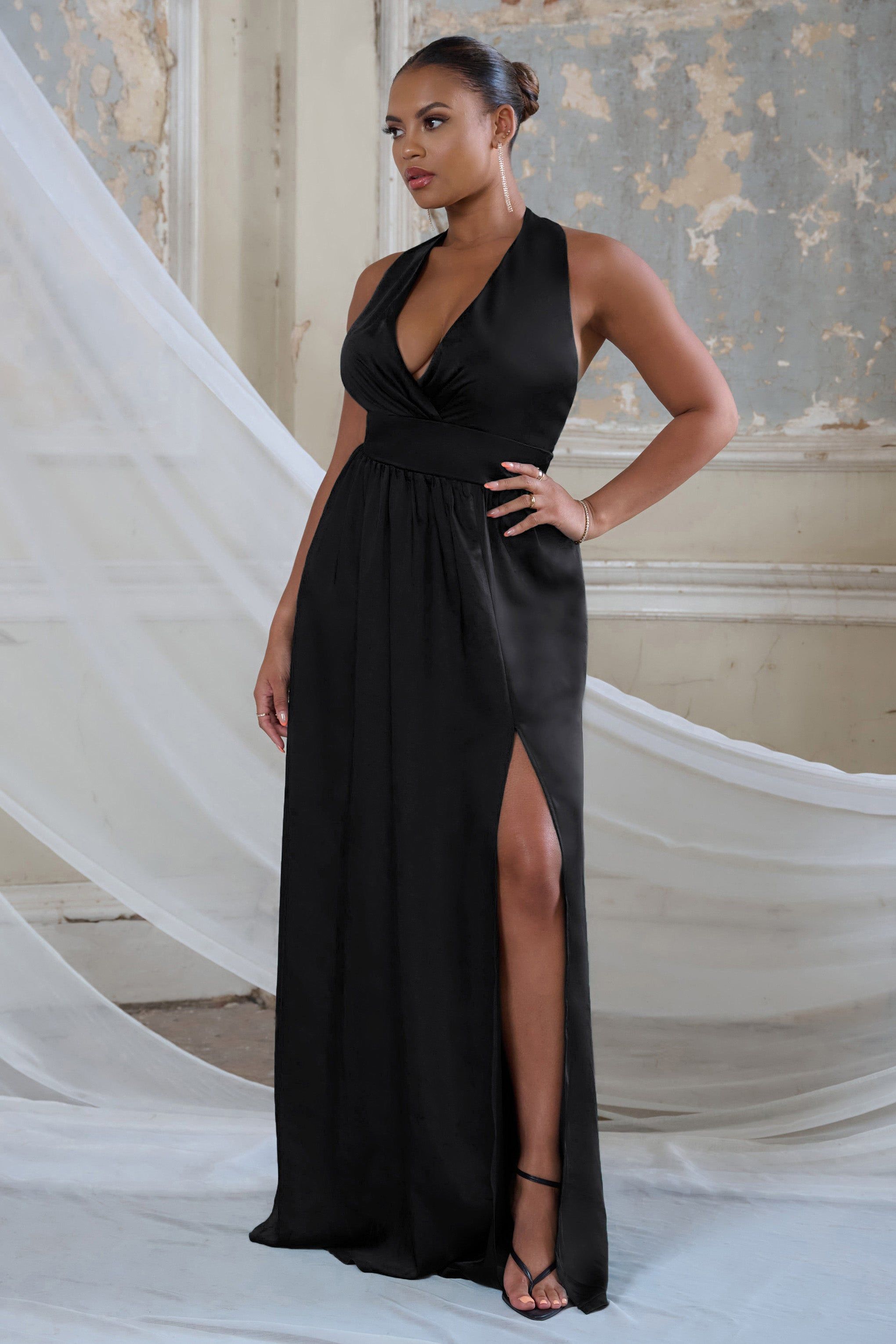 Darling | Black Satin Halter Neck Bow Back Thigh Split Maxi Dress sold by Club L London