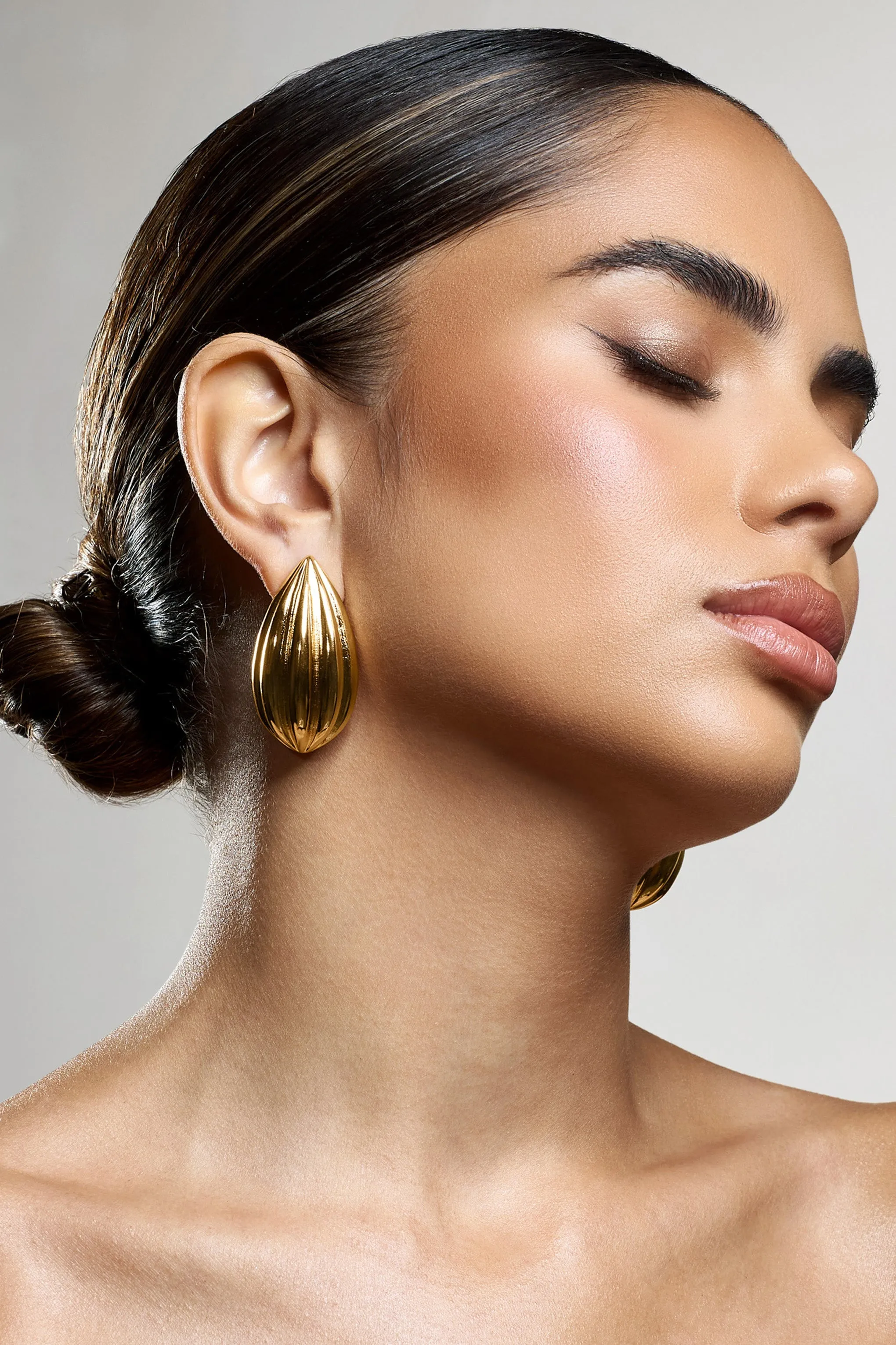Hollis | Gold Statement Teardrop Earrings sold by Club L London