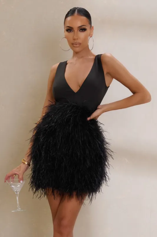 Flirt | Black Plunge Front Mini Dress With Feather Skirt sold by Club L London