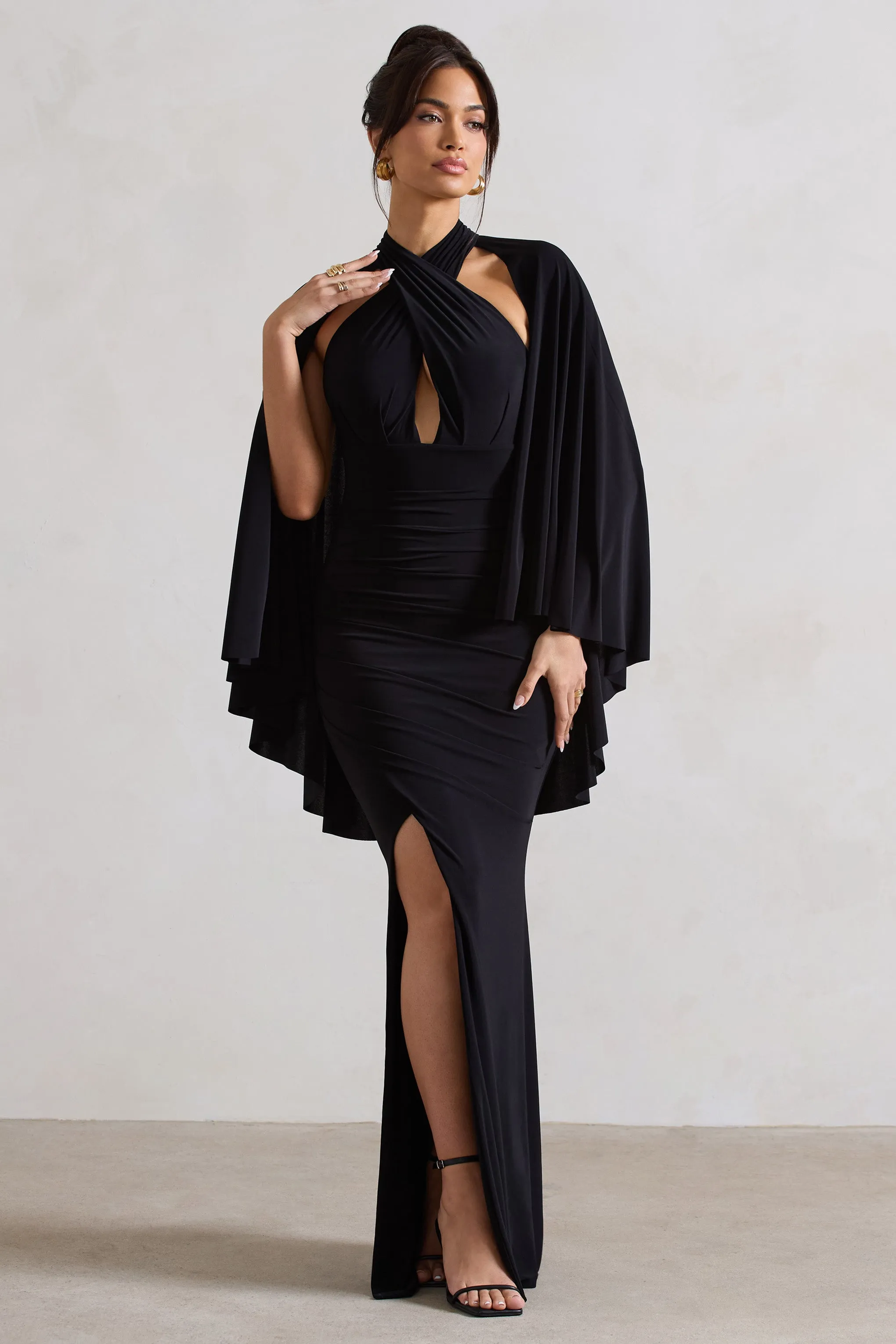 Audrina | Black Ruched Halter-Neck Split Maxi Dress With Cape sold by Club L London